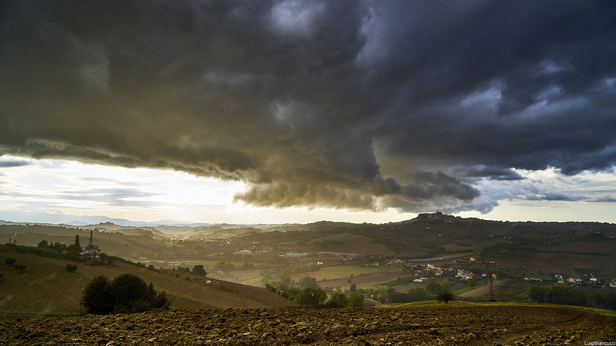 Rain Sun and clouds on the plain
