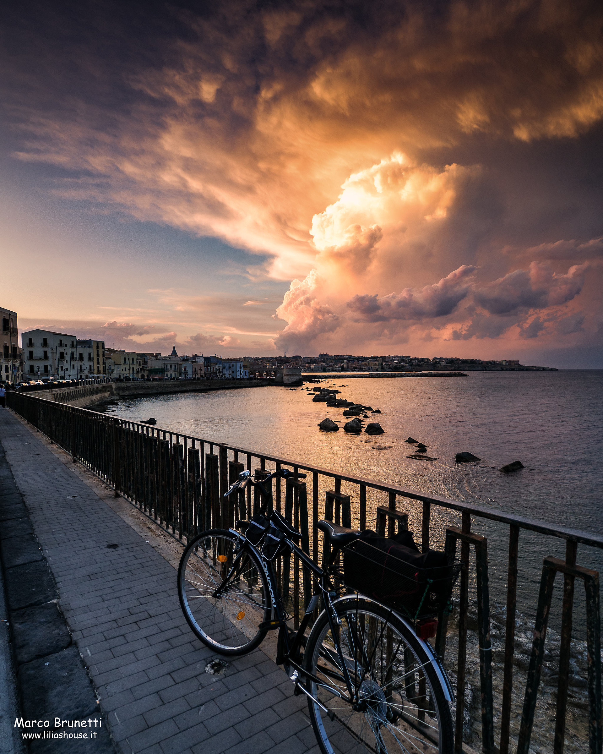 with my bike watching the sunset