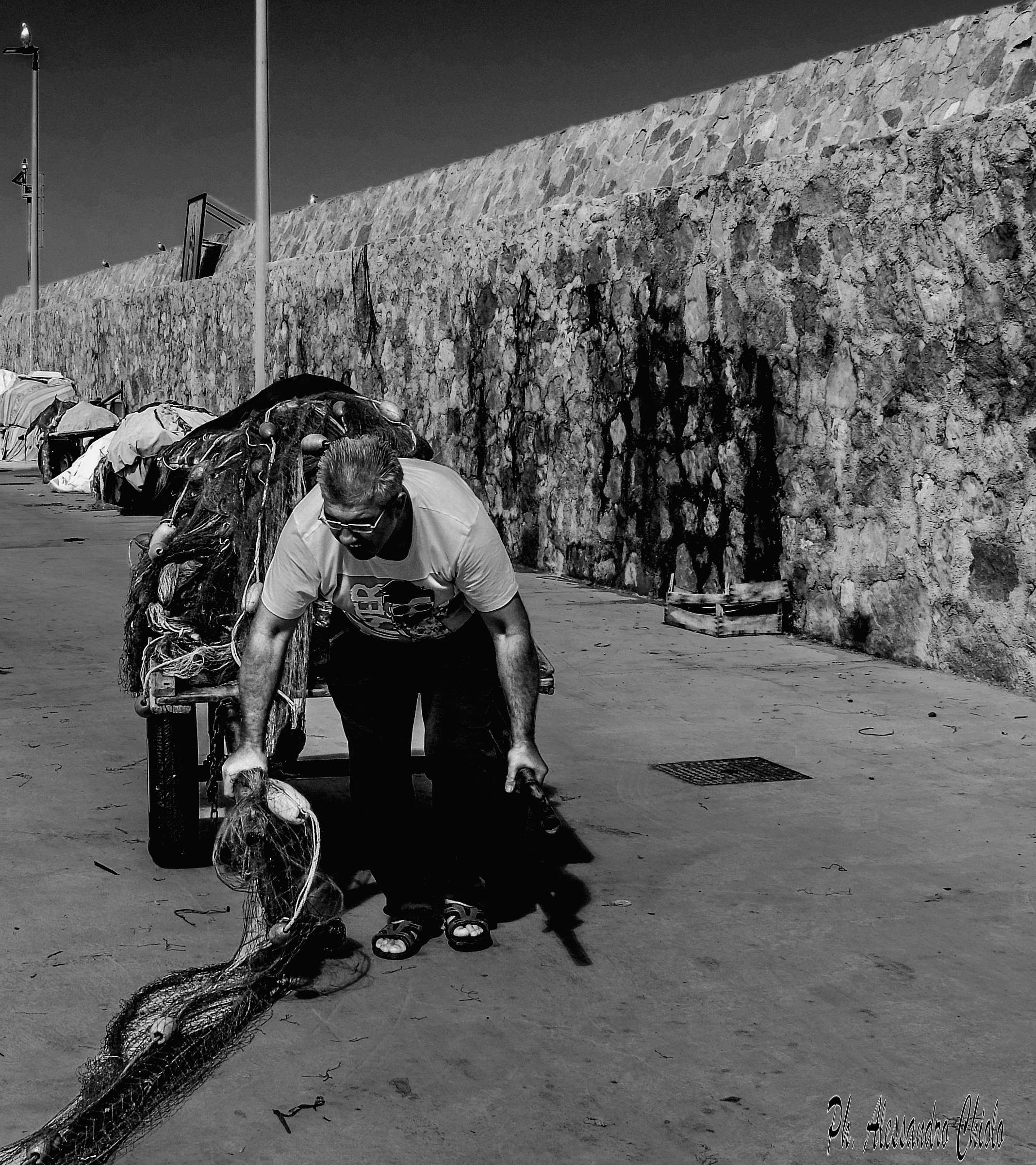 Folded by the heavy weight of fishing nets