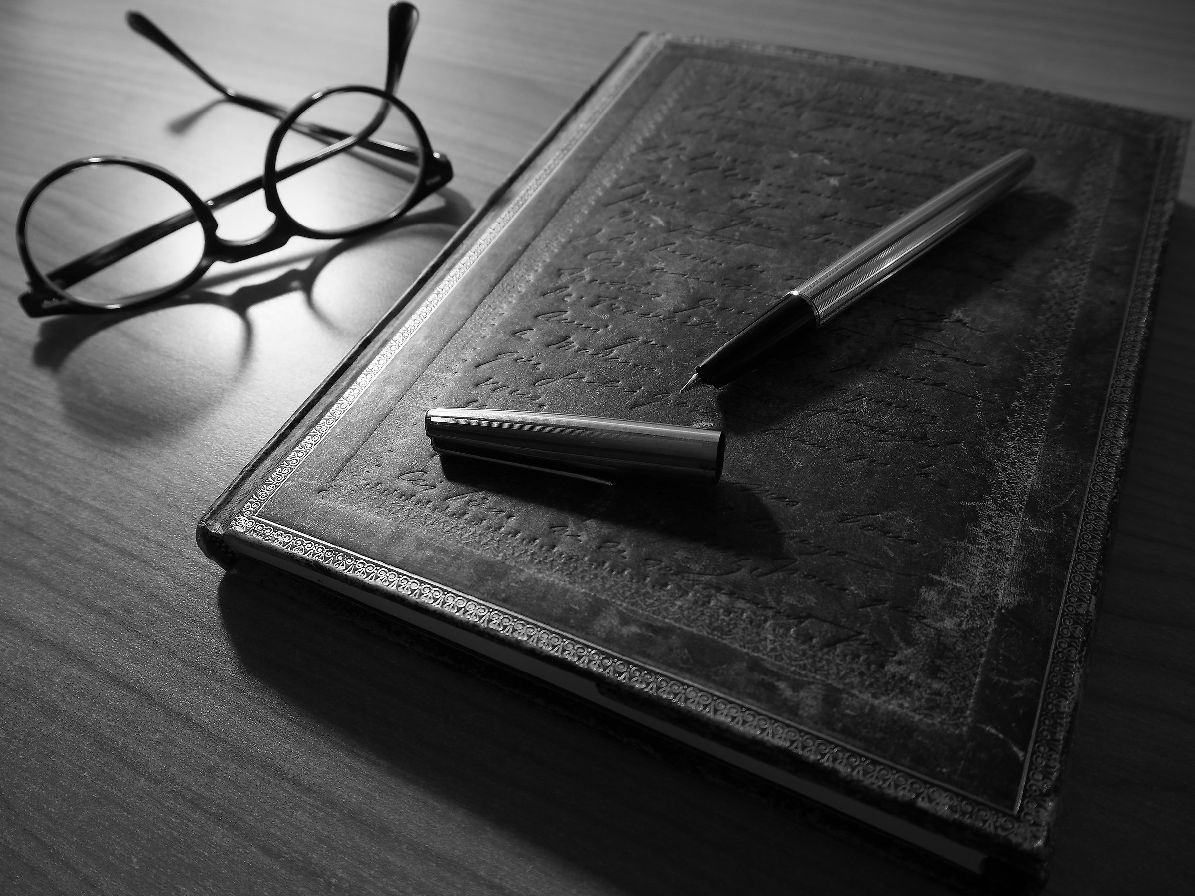 Stylograph Pen, old book and lens