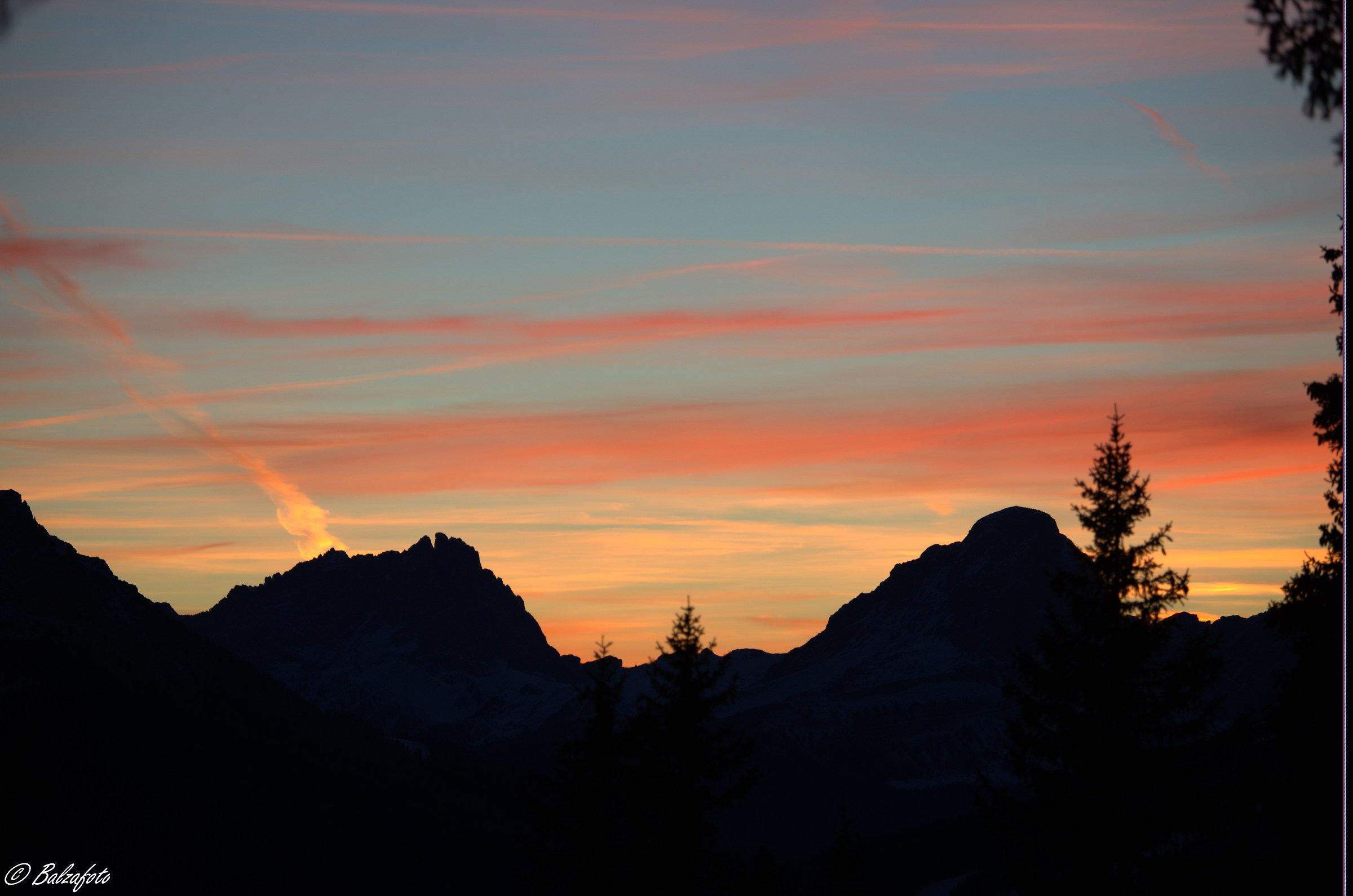 Dolomites at sunset view from the woods