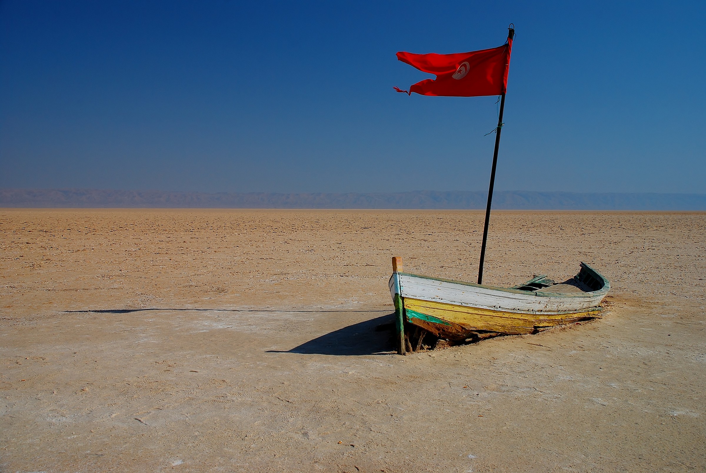 Boat in dry salt lake ...