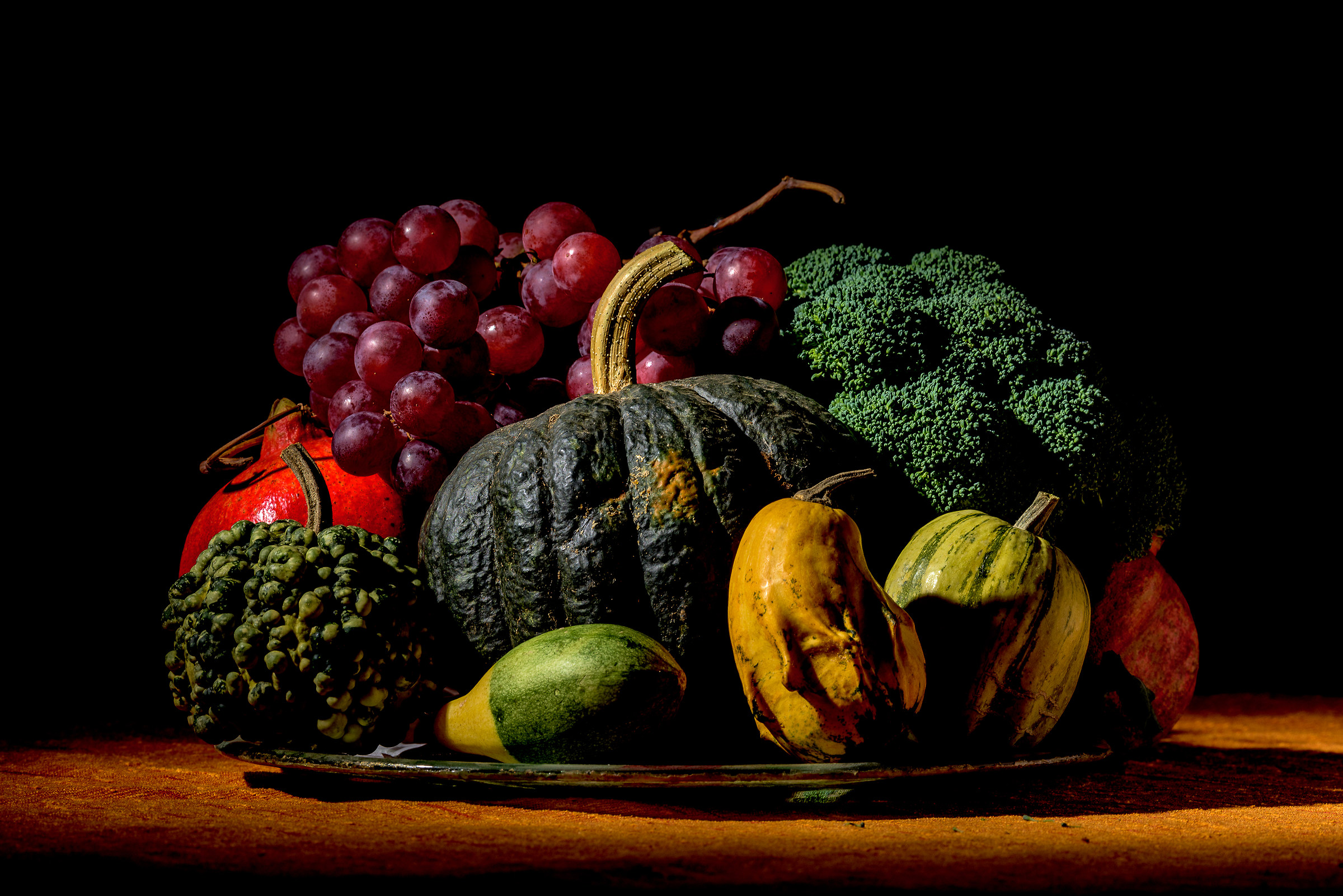 Autumn composition: pumpkins, pomegranates and broccoli