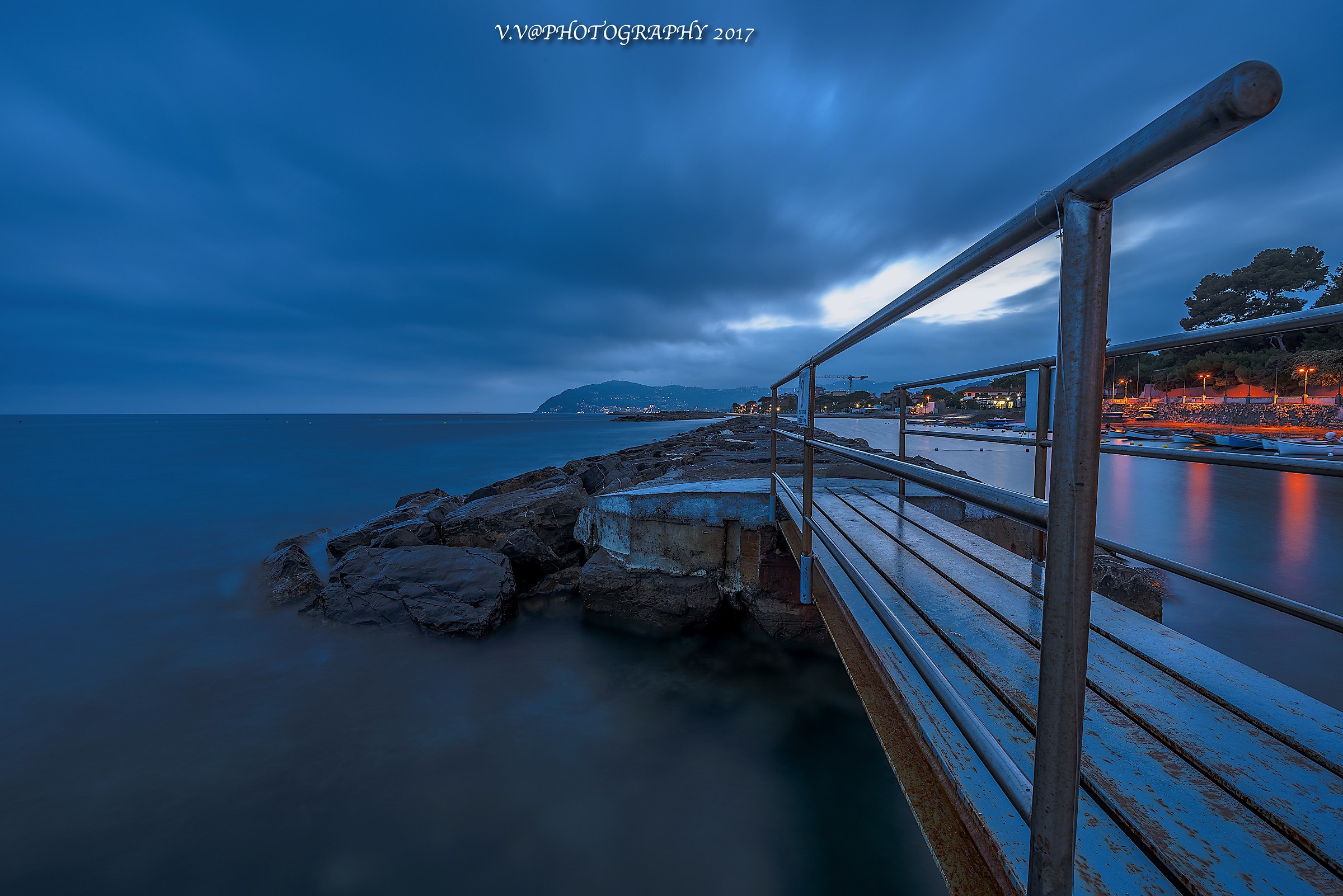 the rocks the bridge the waves