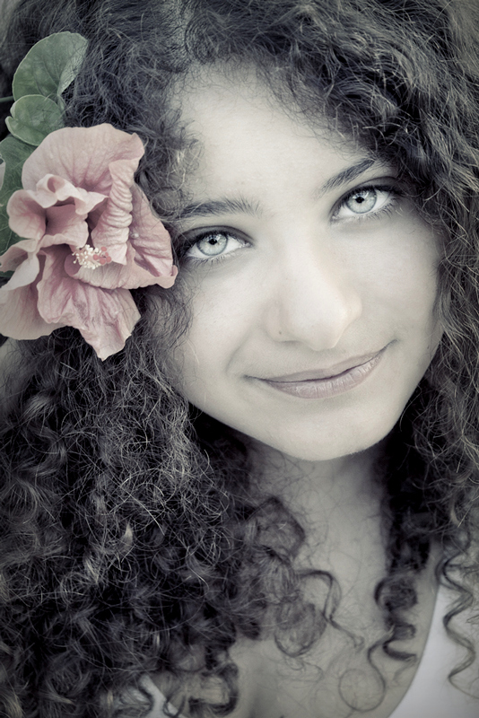 a hibiscus in her hair ...