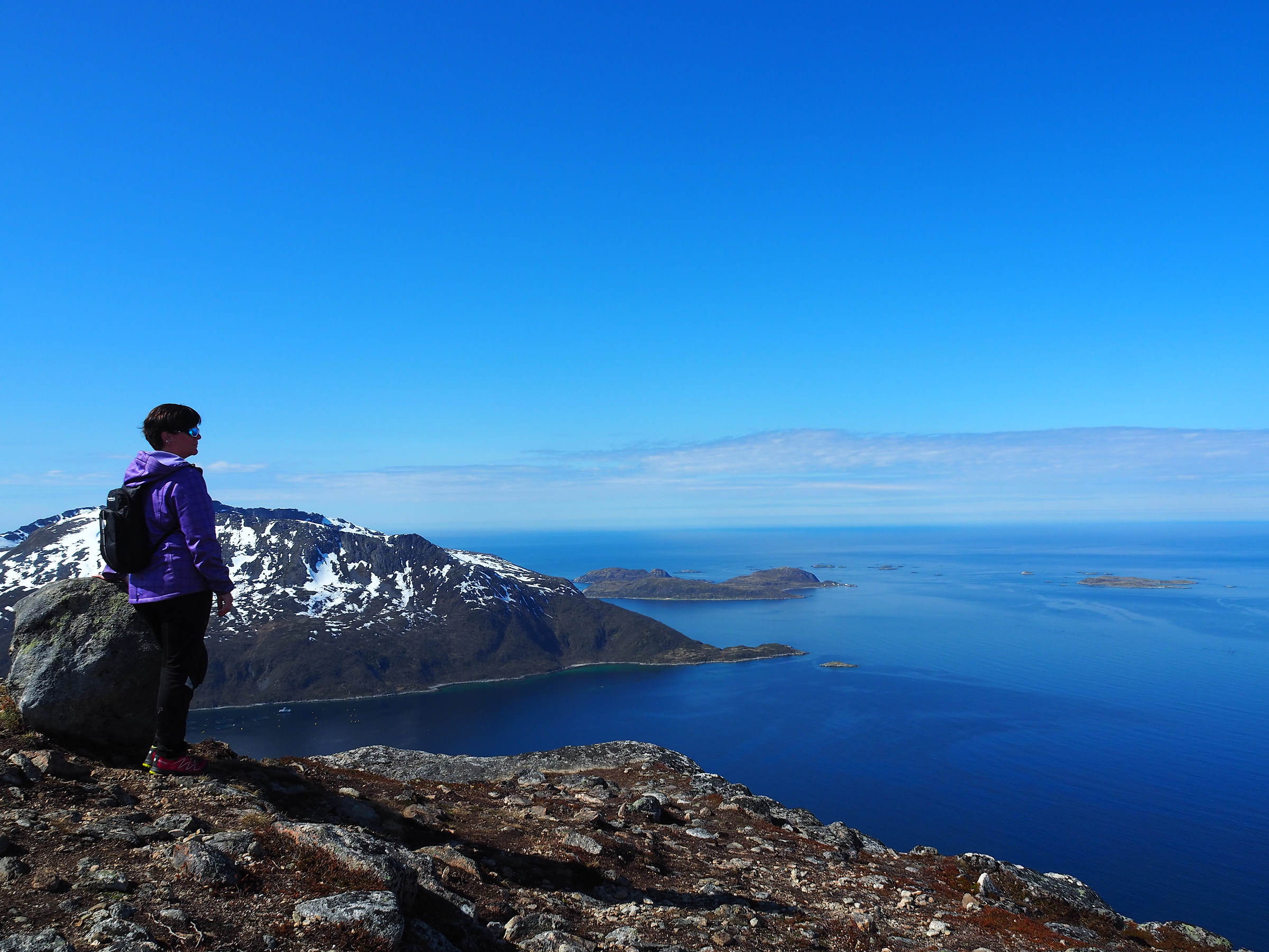 female hiker looking at Norwegian Sea