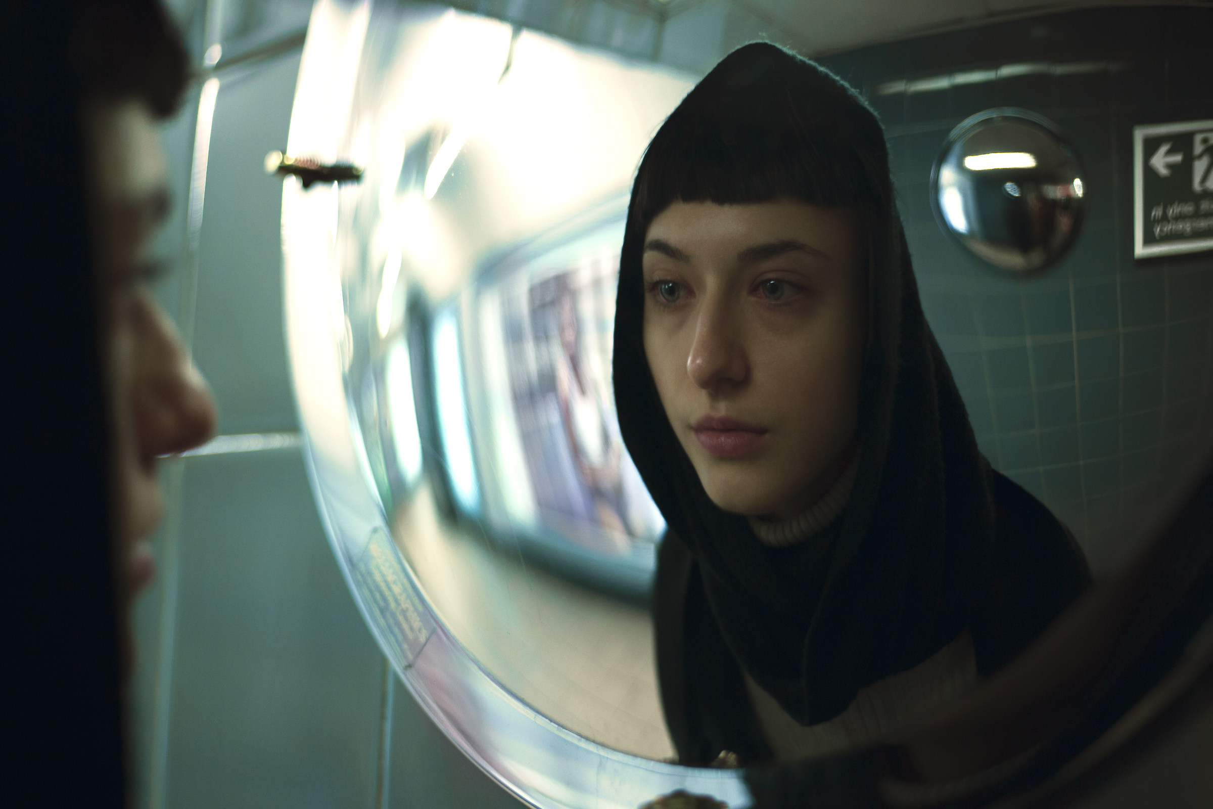 How many faces can a human be? I count three here.