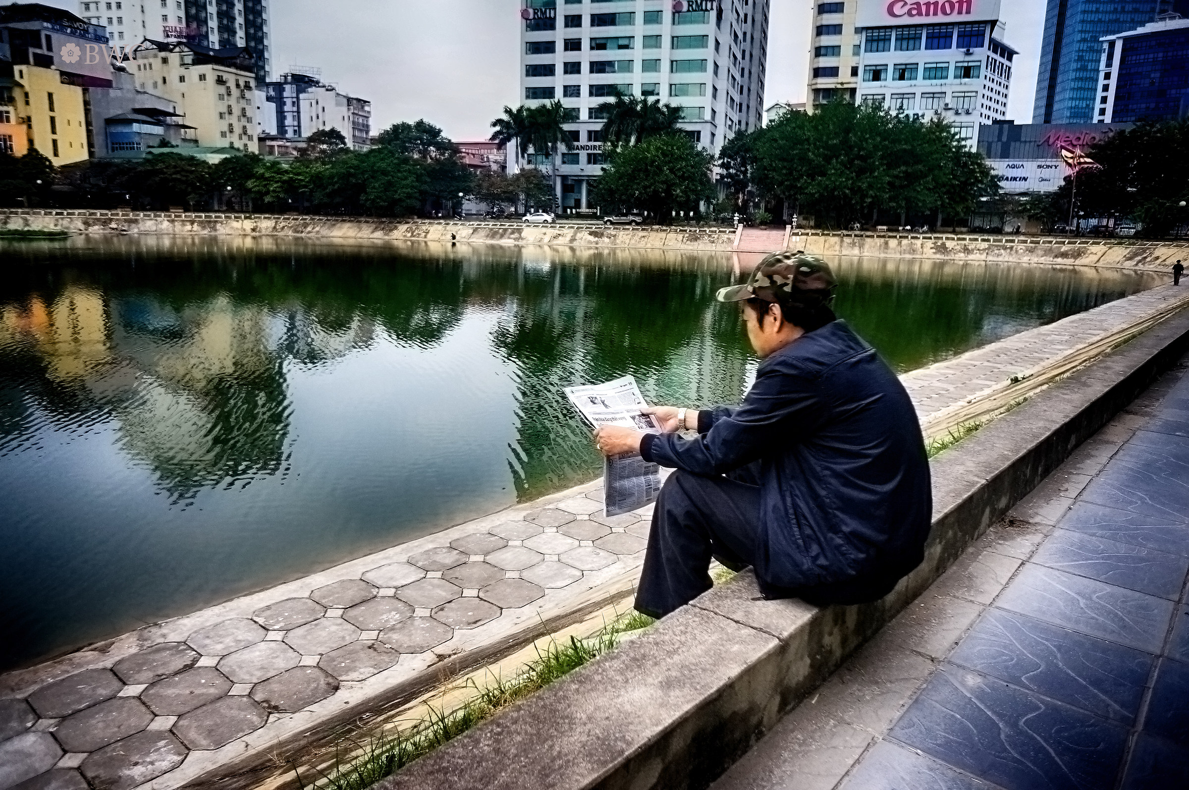 Bad Guy Reading News By The Lake