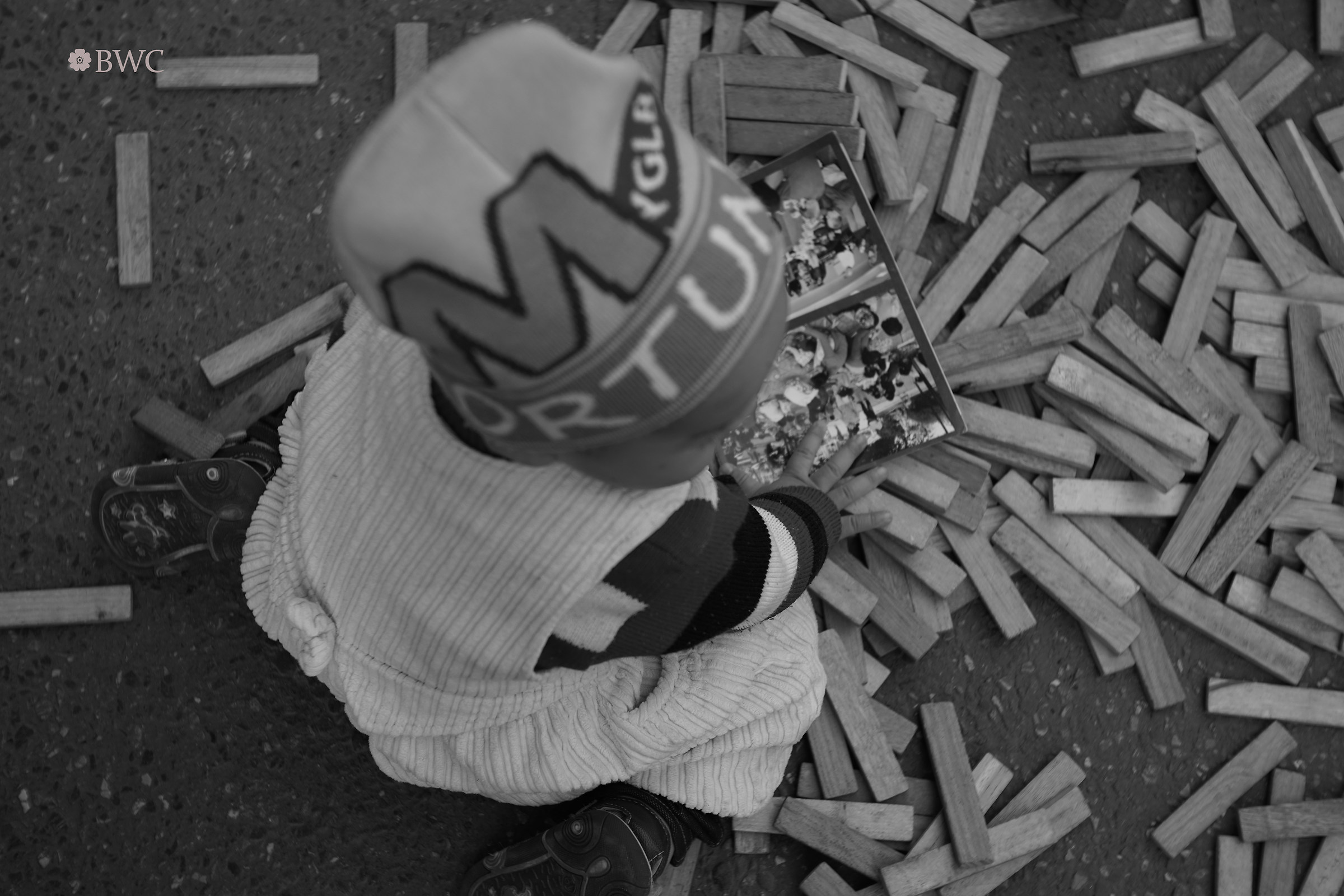 Baby Playing With Pieces Of Wood