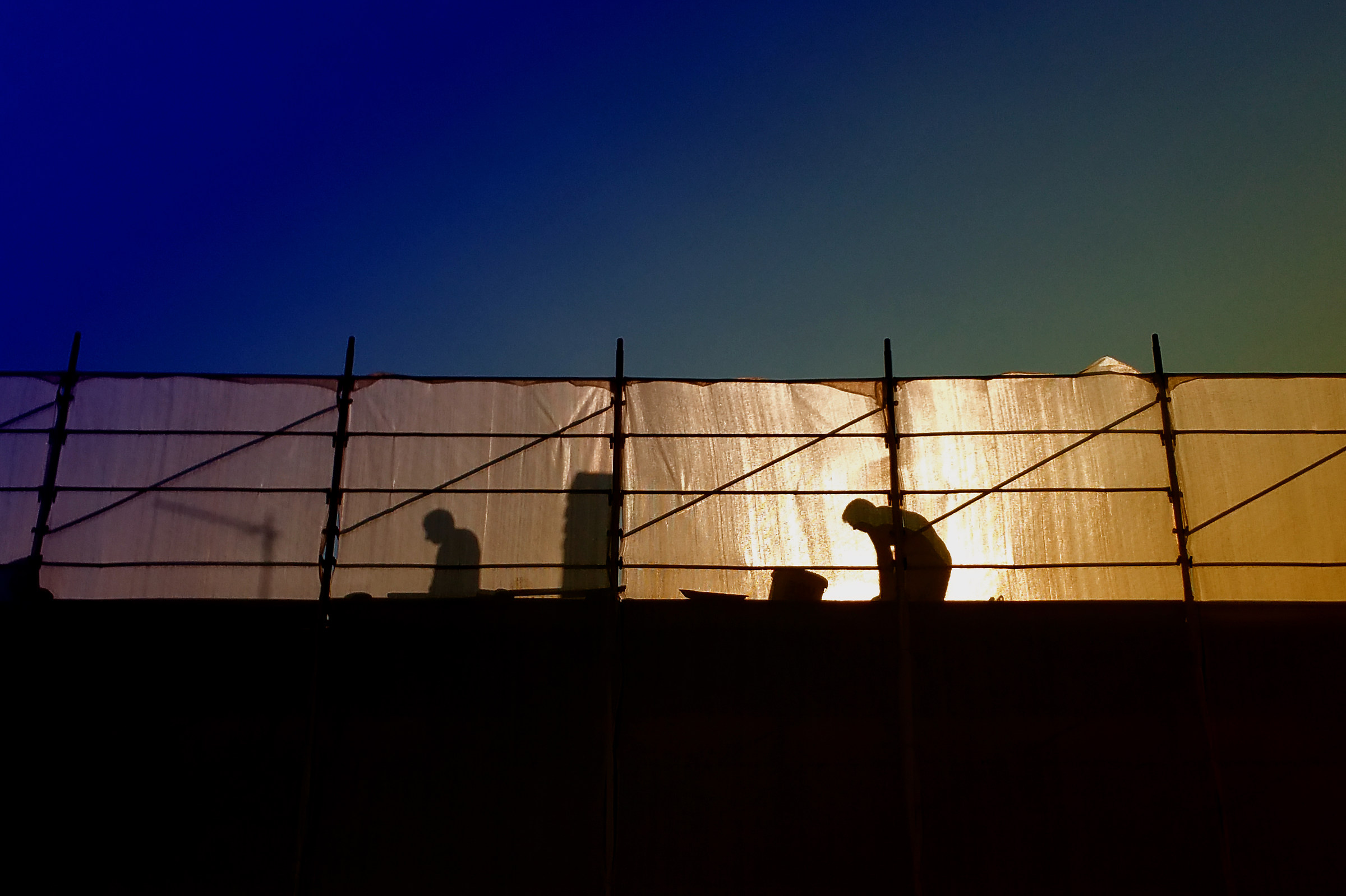 Workers At The Sunset