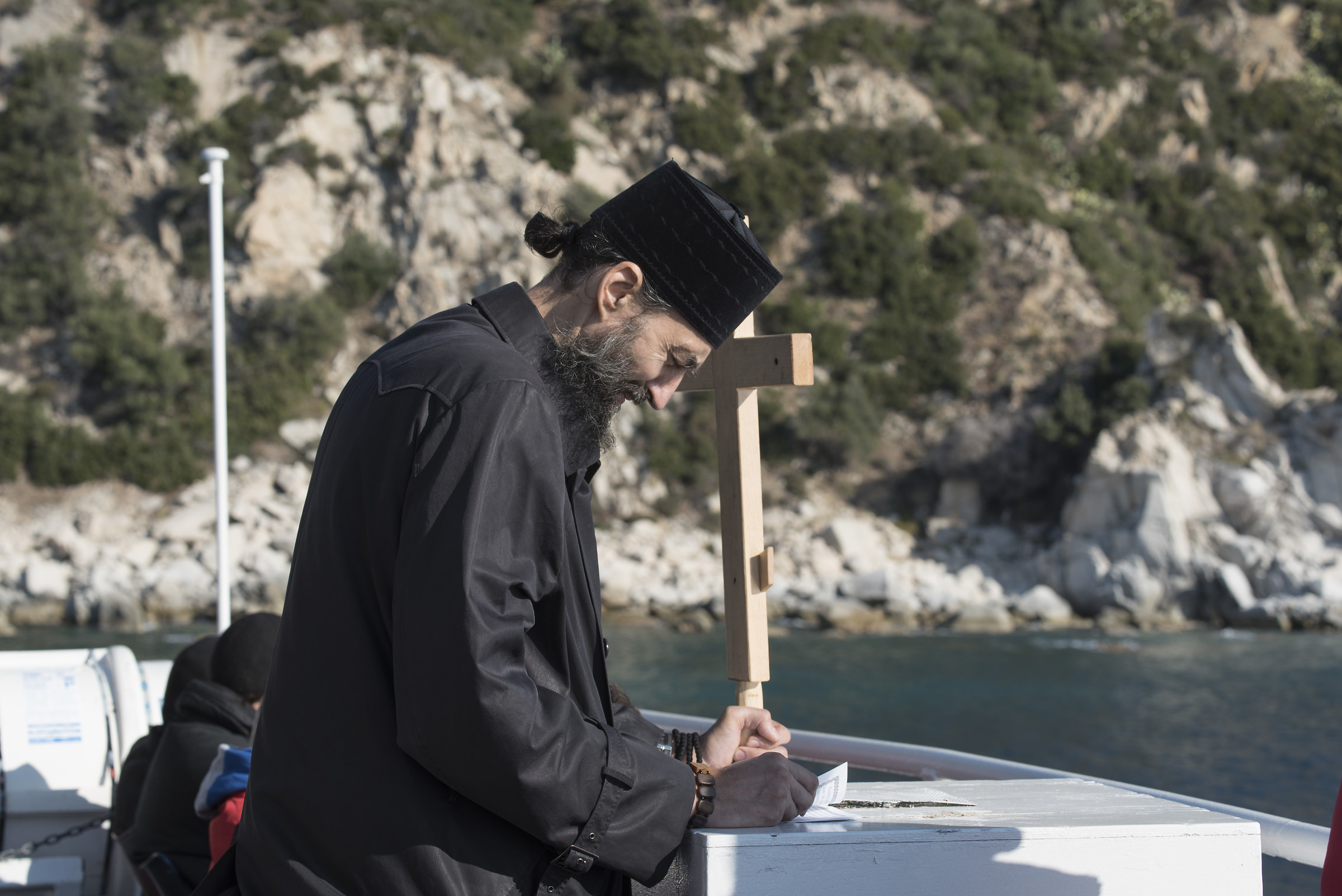 Monk in prayer on the ferry