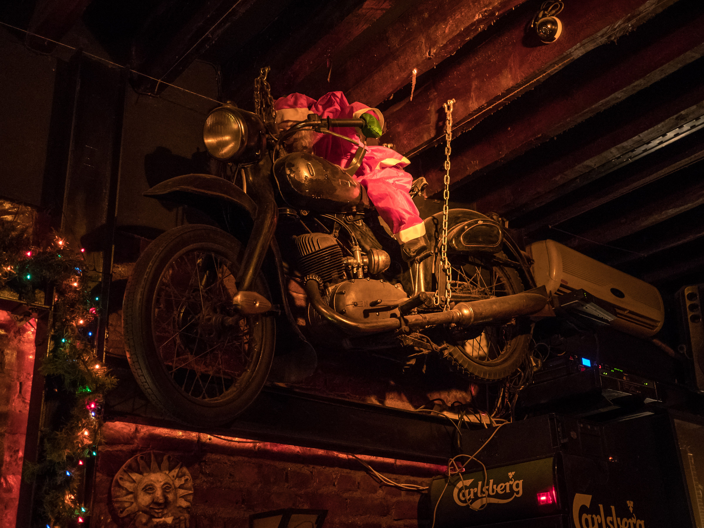 Santa Claus laughs at motorcycle