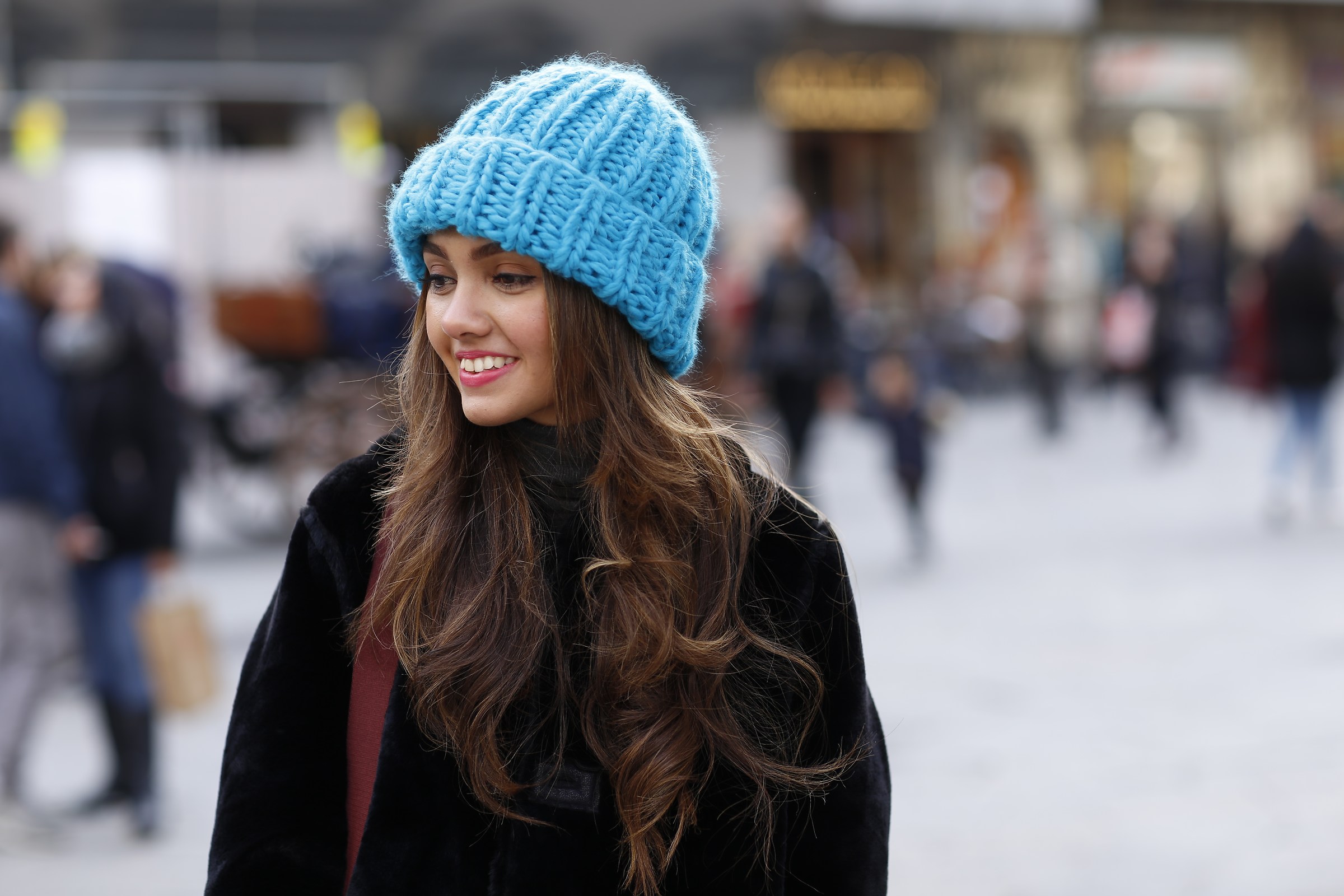 The girl in the turquoise hat