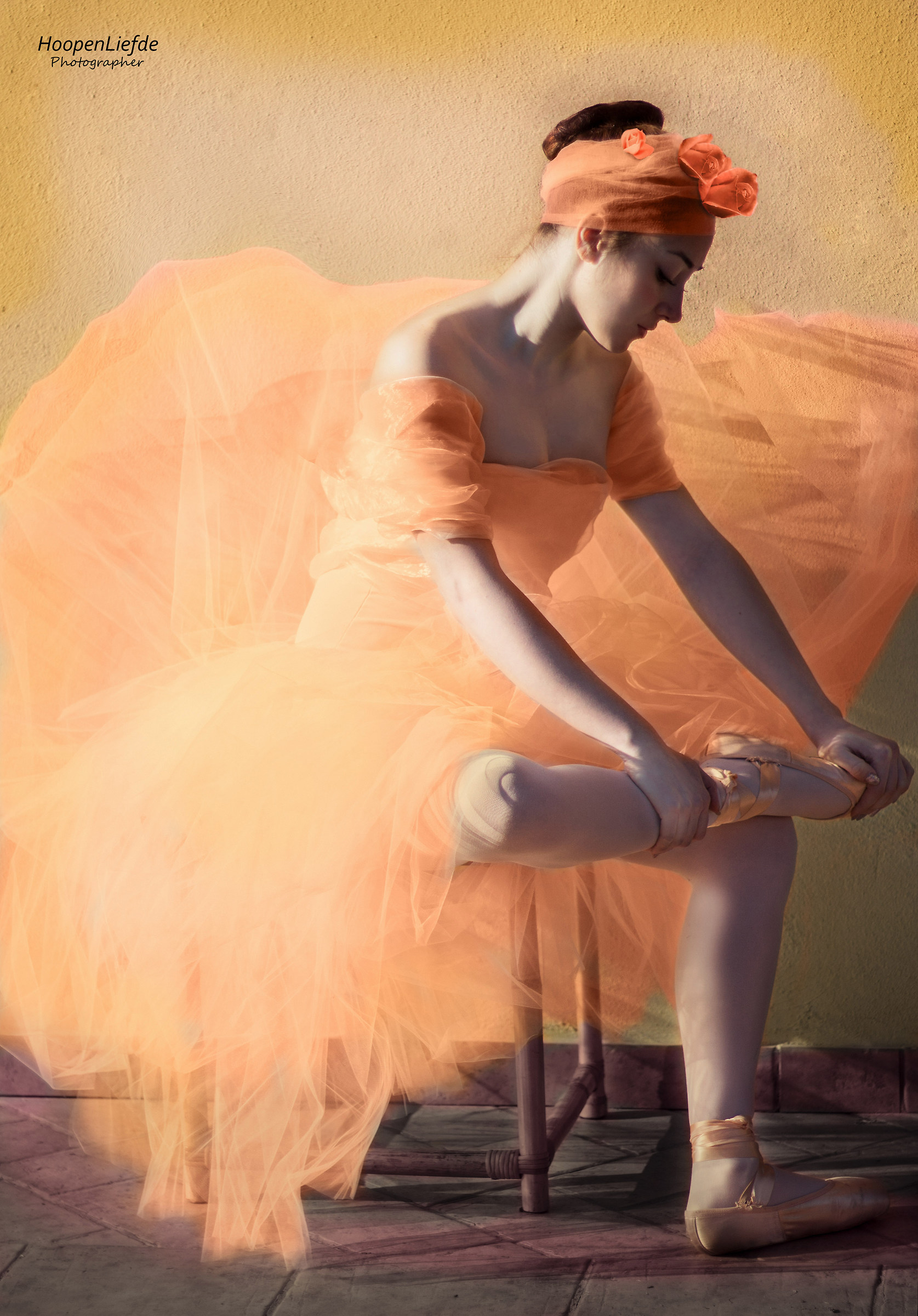 "The dancer who adjusts the sandal"