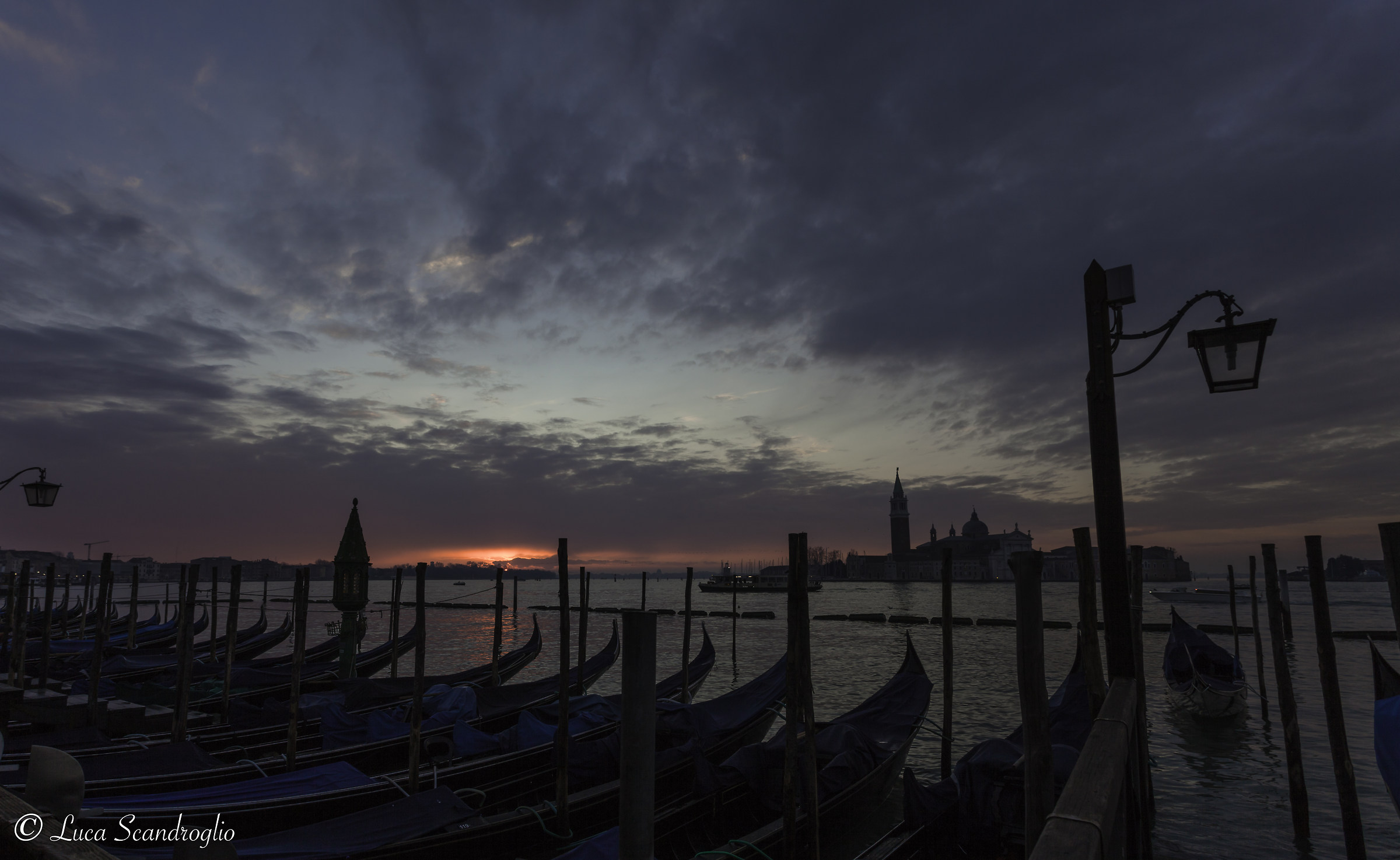 Gondolas and sunrise on Venice