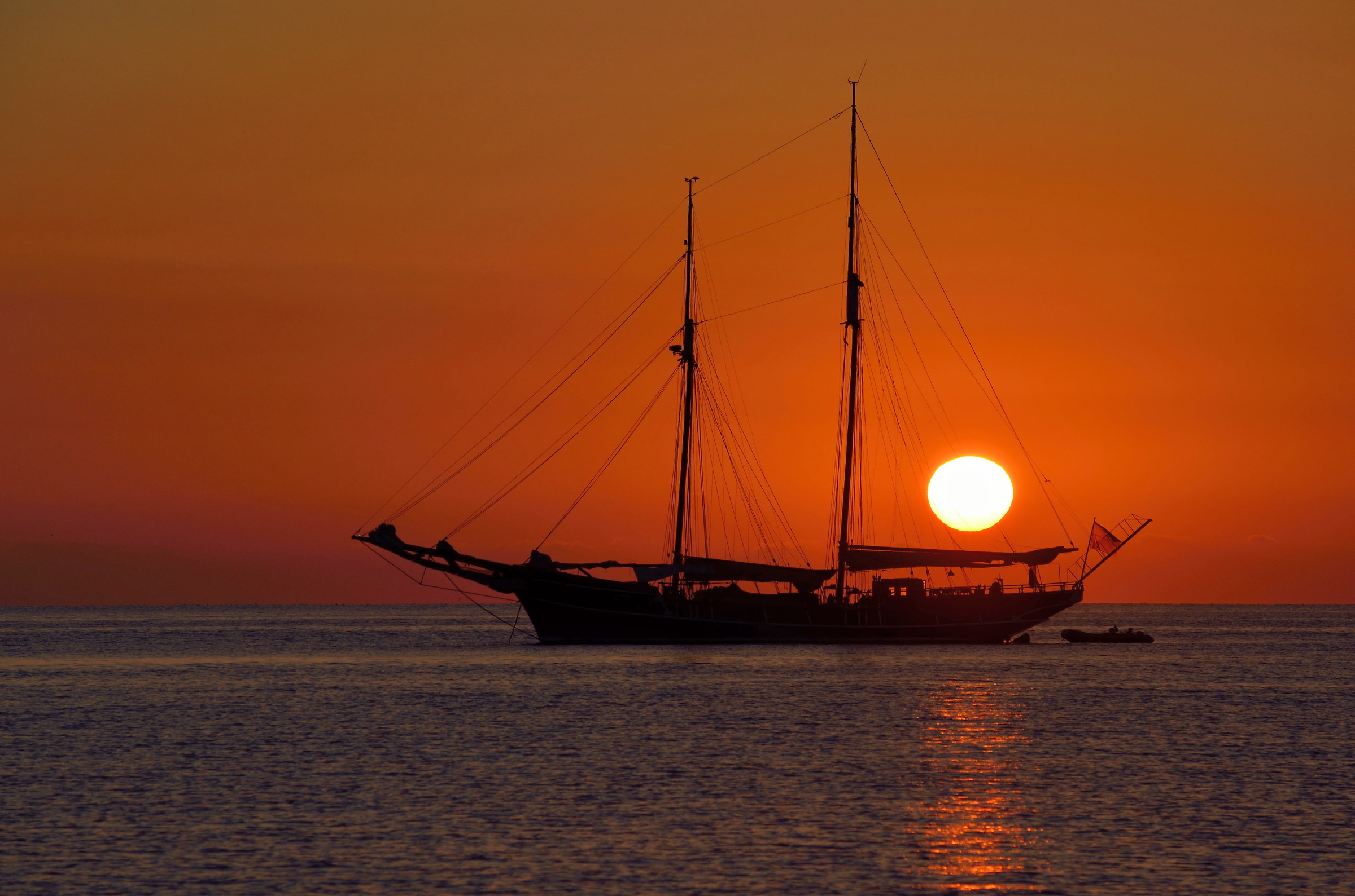Sunrise with sailing ship