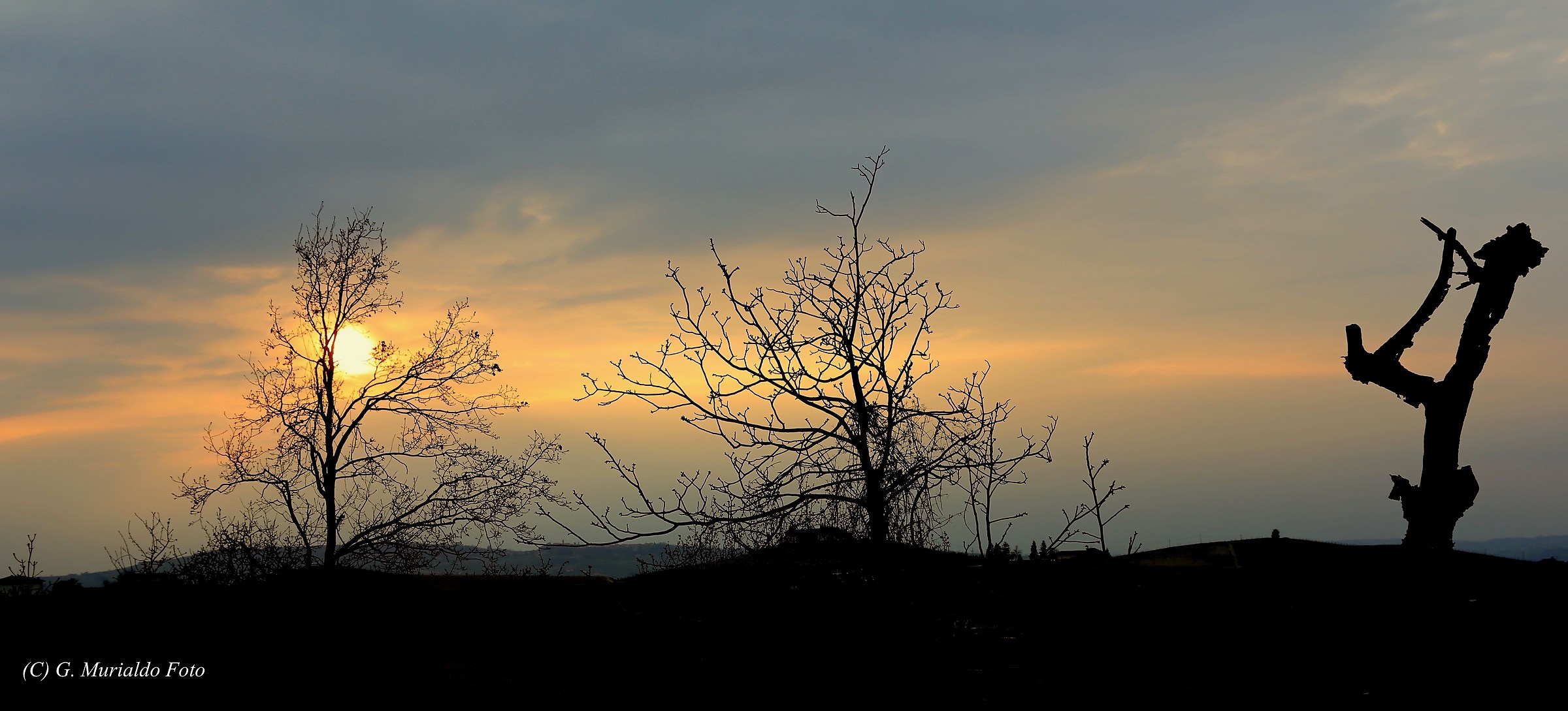 Fumatore di calumèt al tramonto