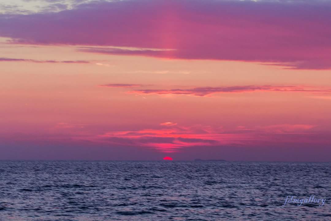 The sun greets us with a last fluorescent ray