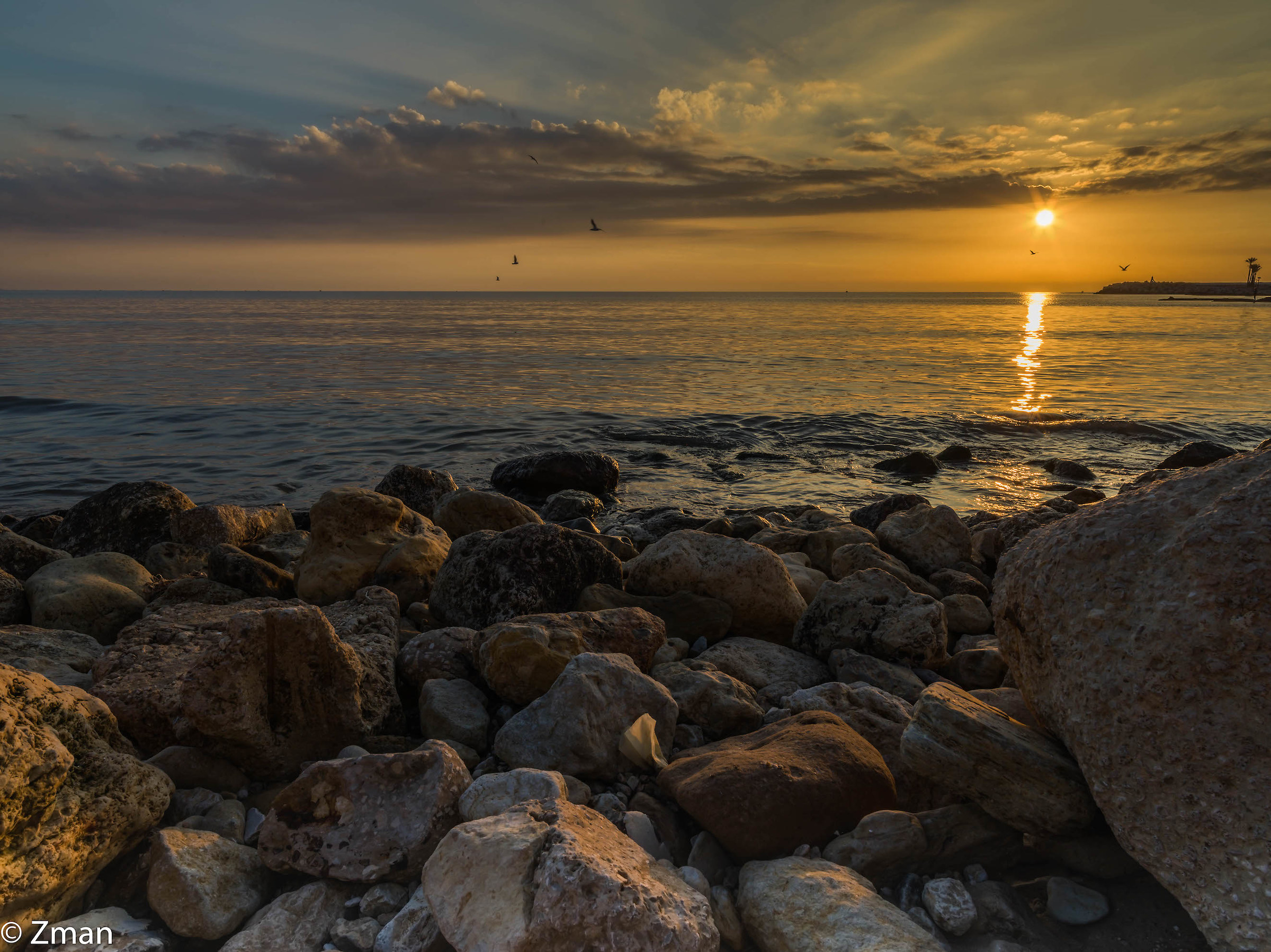 Rocce, mare e tramonto
