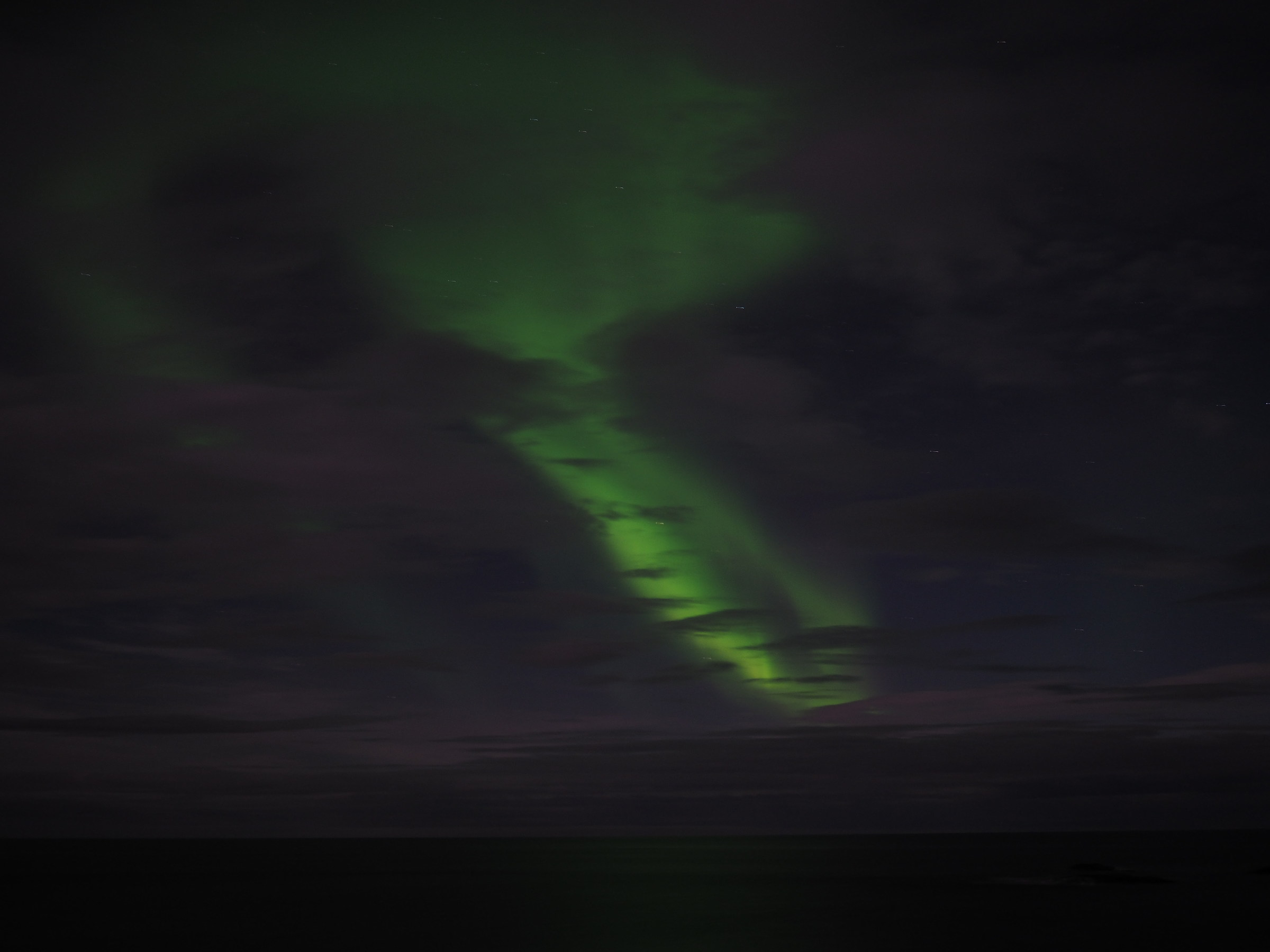 north from here, there's fire in the nightsky.