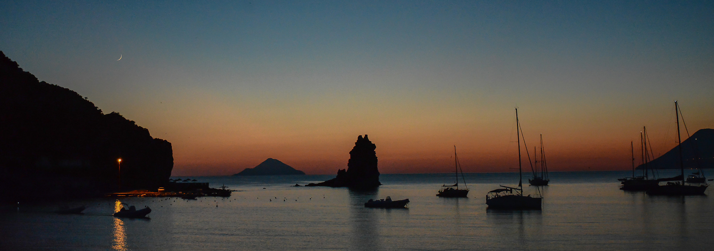 Black sand-sunset over the caldera Volcano