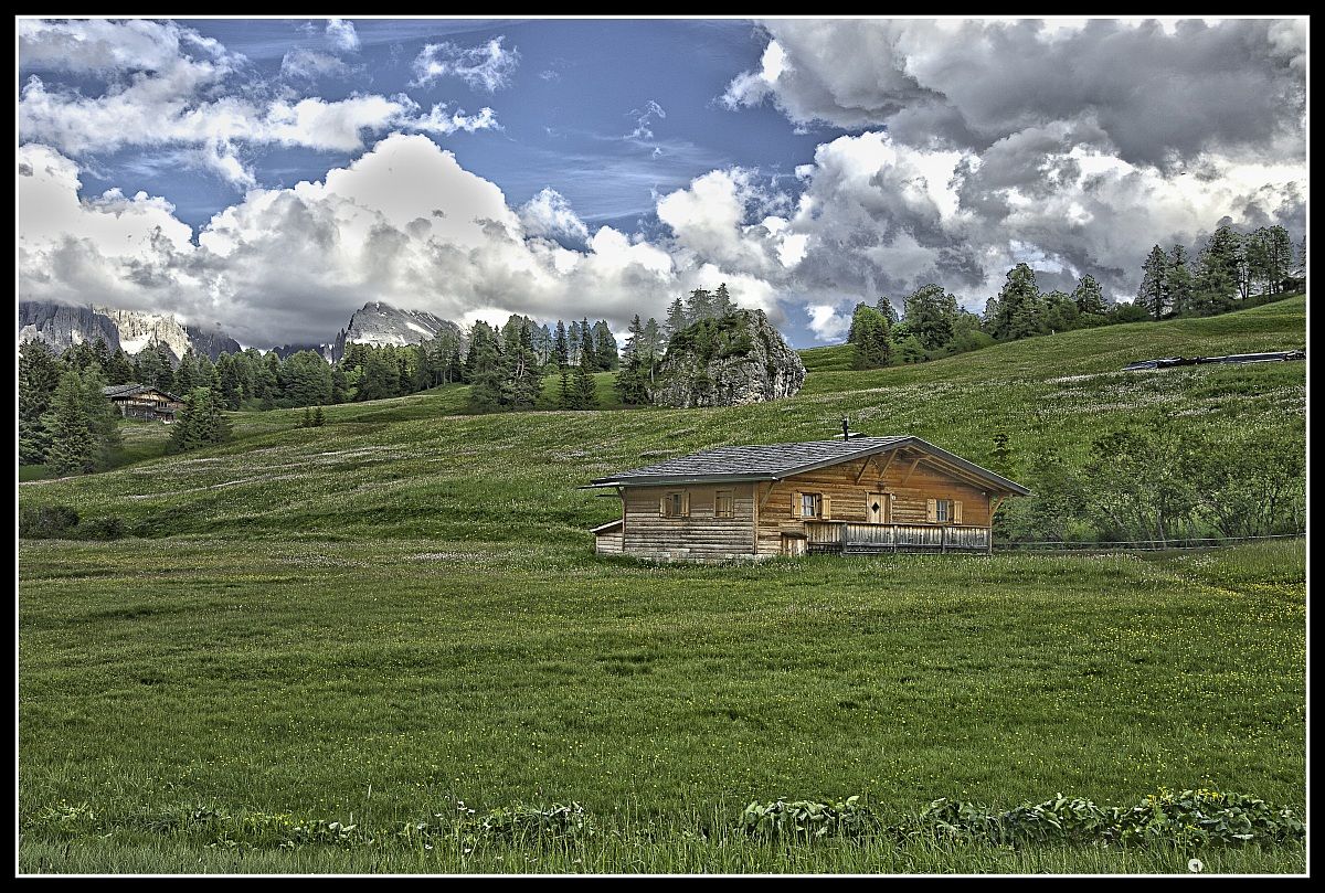 Alp siusi - Sassolungo and Sassopiatto in the clouds