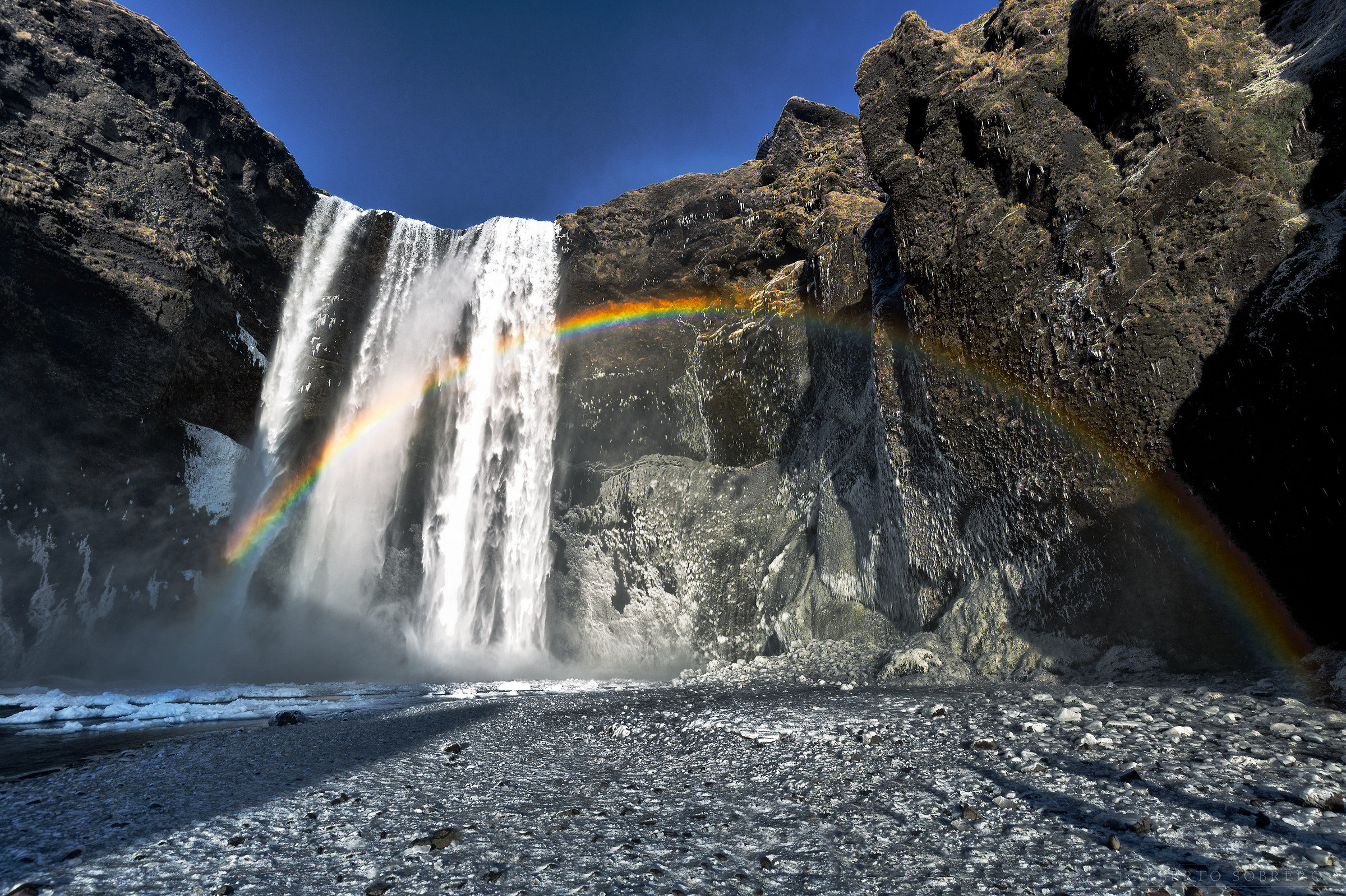 A cold sunset over the Rainbow-Skogafoss