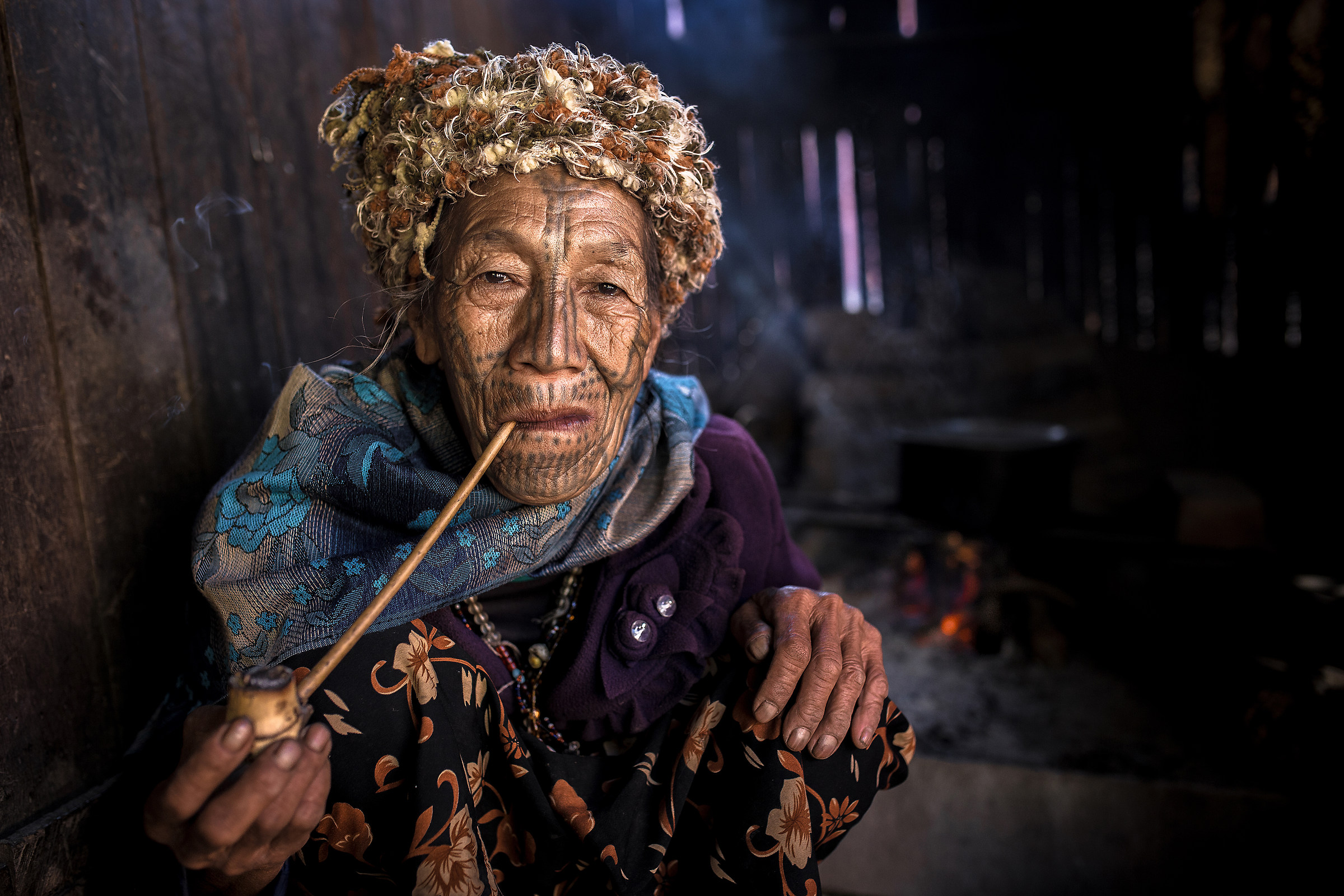 Burma, smoking his pipe by the fire ...