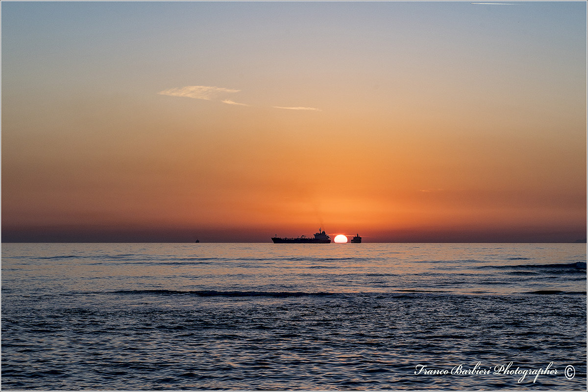 Sunset between ships