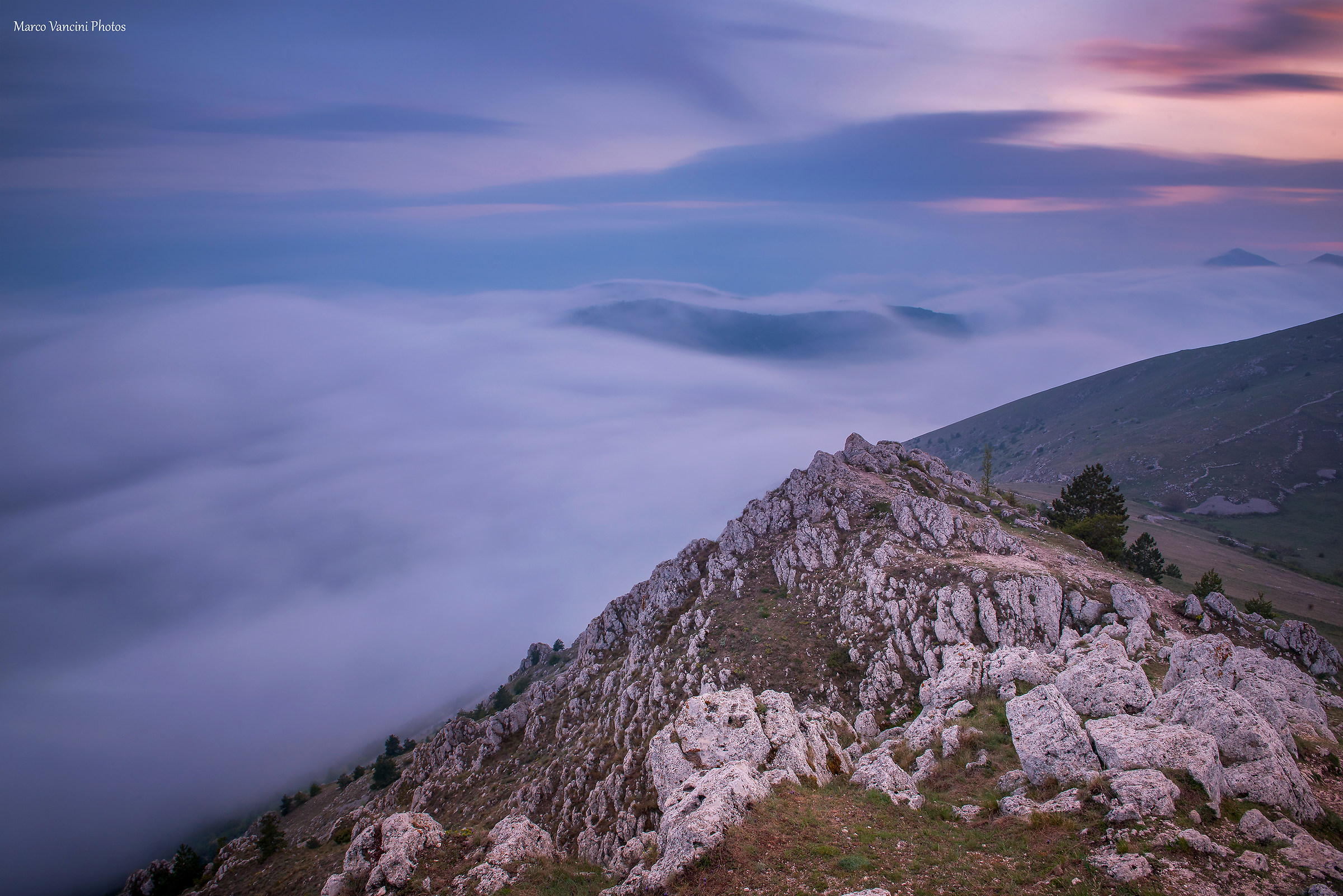a sunset above the clouds