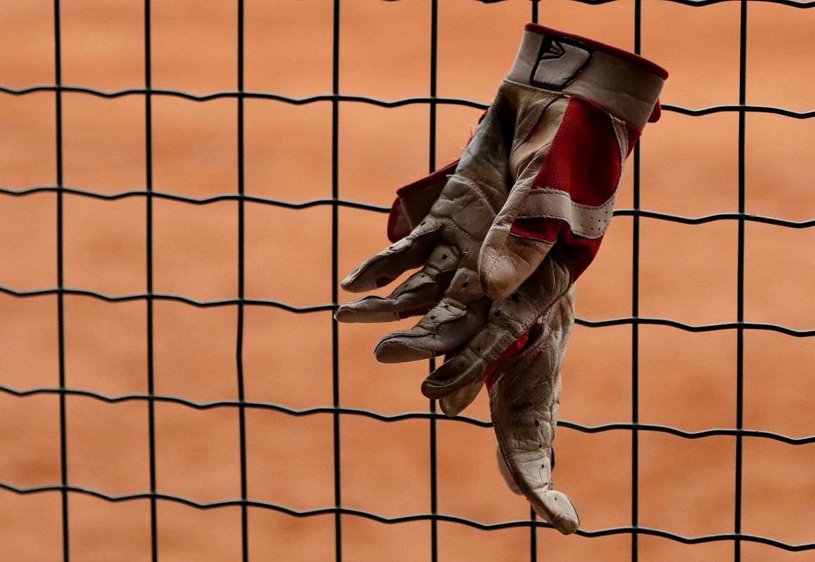 On the bench. (Baseball-Softball)
