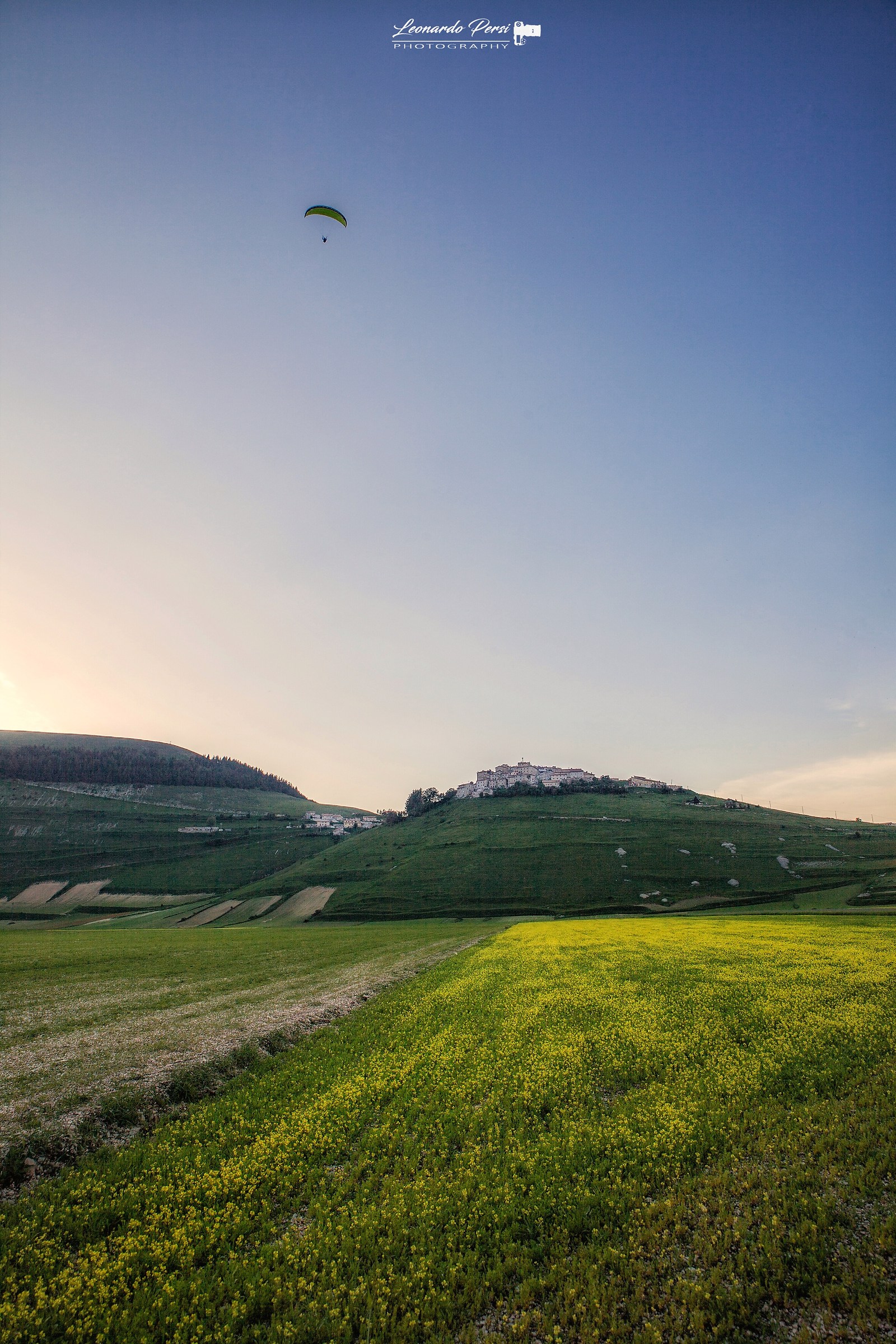 By flying over Castelluccio...