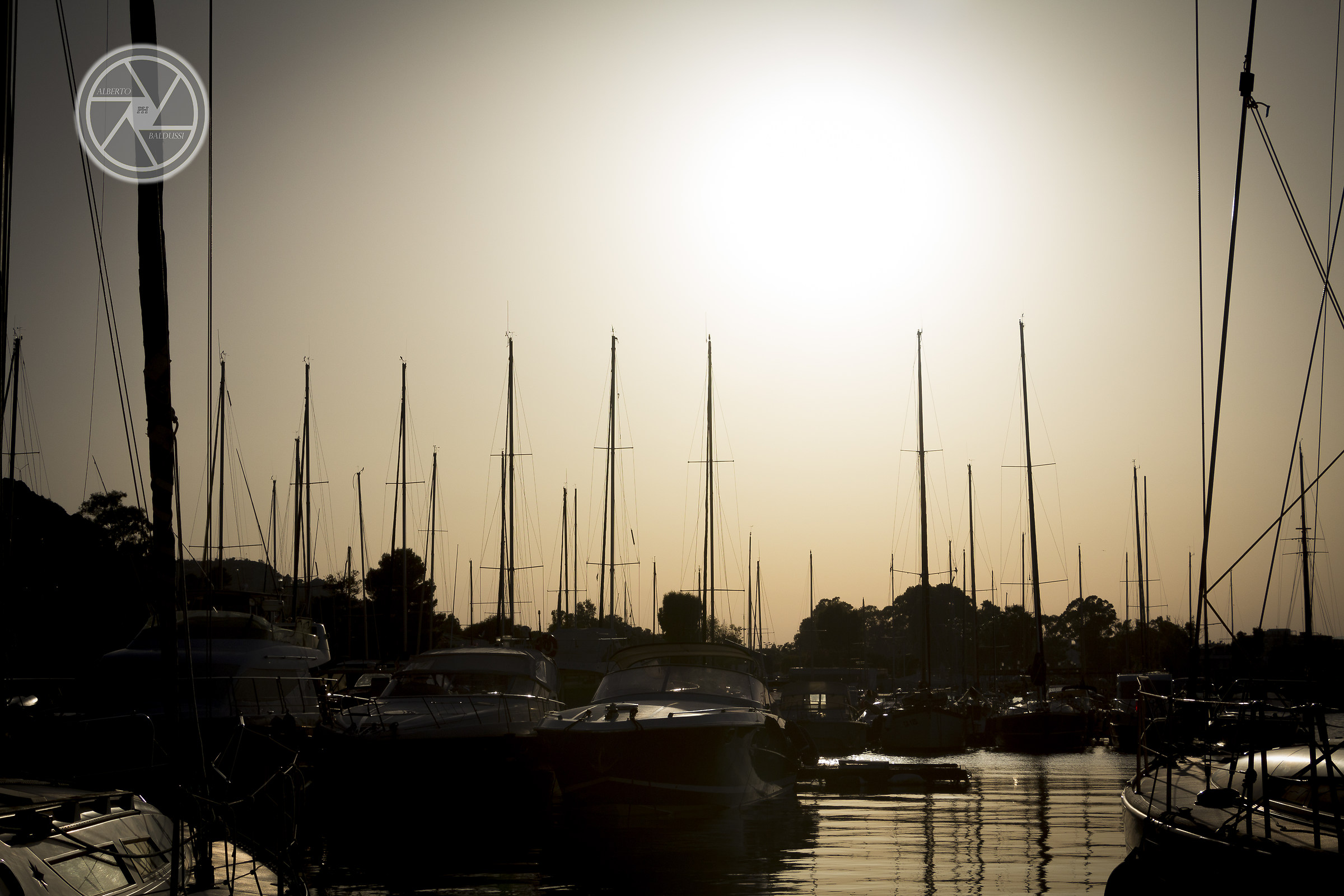 Sunset between boats