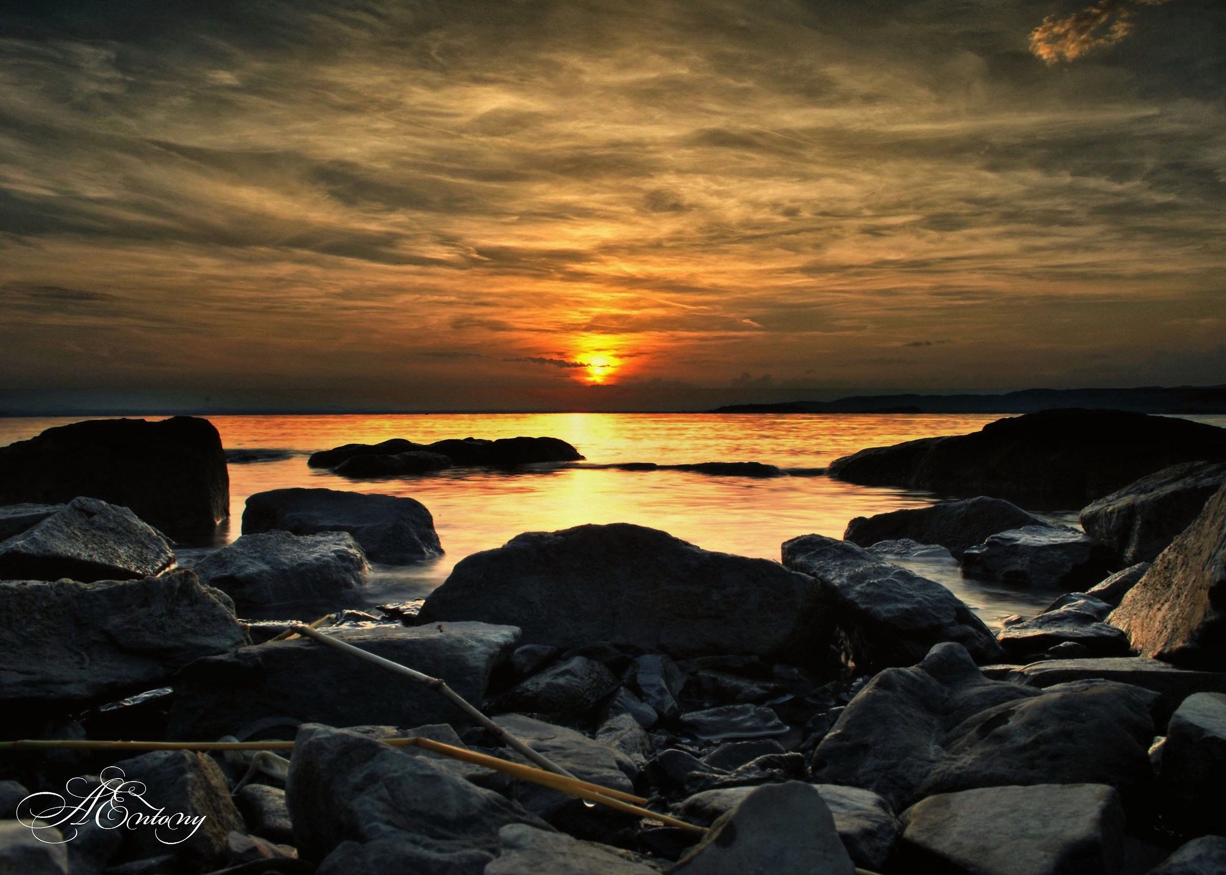 A wind wire on the lakefront at sunset
