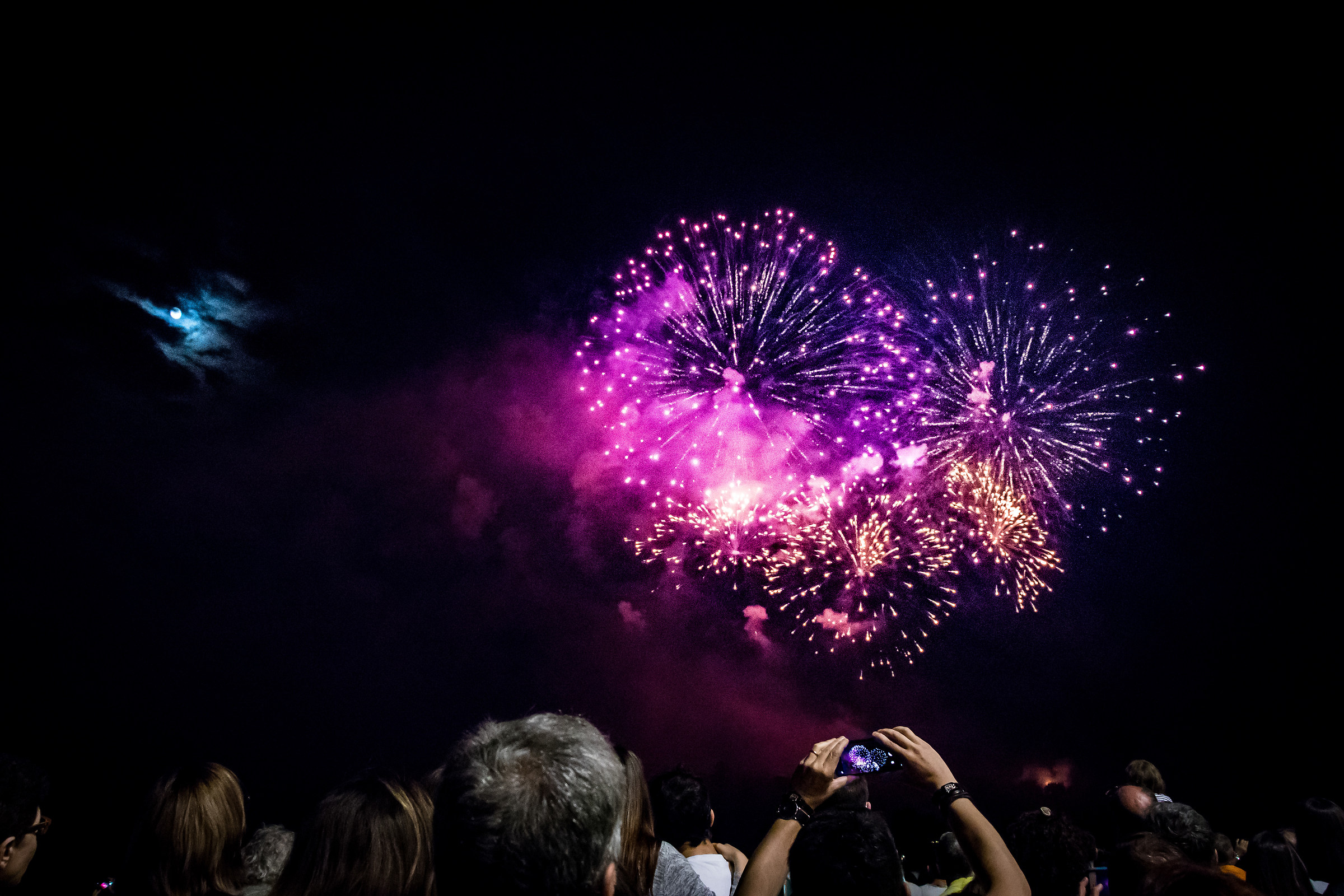Fireworks... Even the moon looks at them