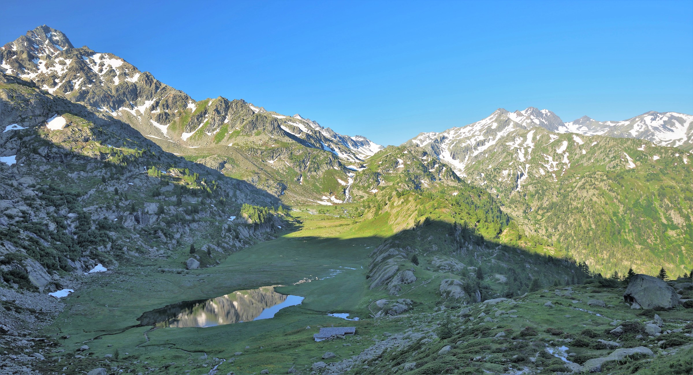 The Alpage du Glacier m 2158 still in the shade-reflections