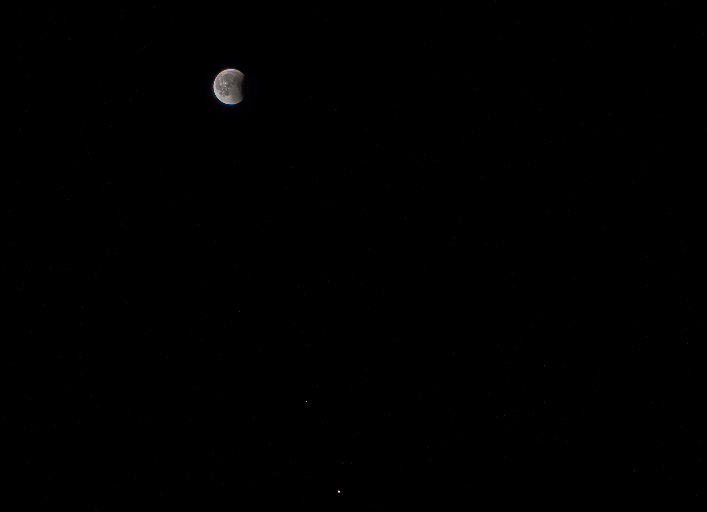 Moon (in the final stages of the eclipse) and Mars