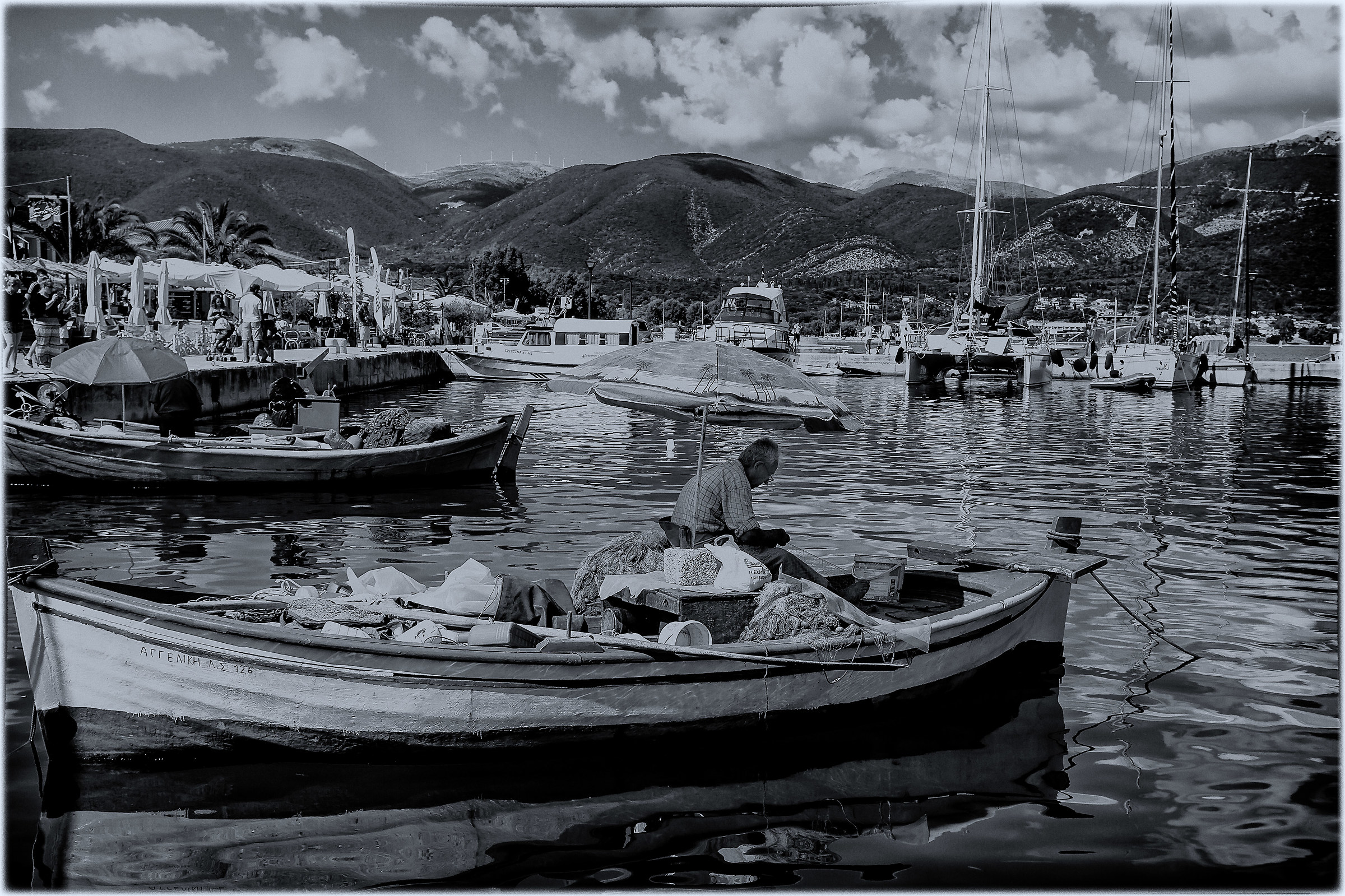 Old fisherman at work in Sami