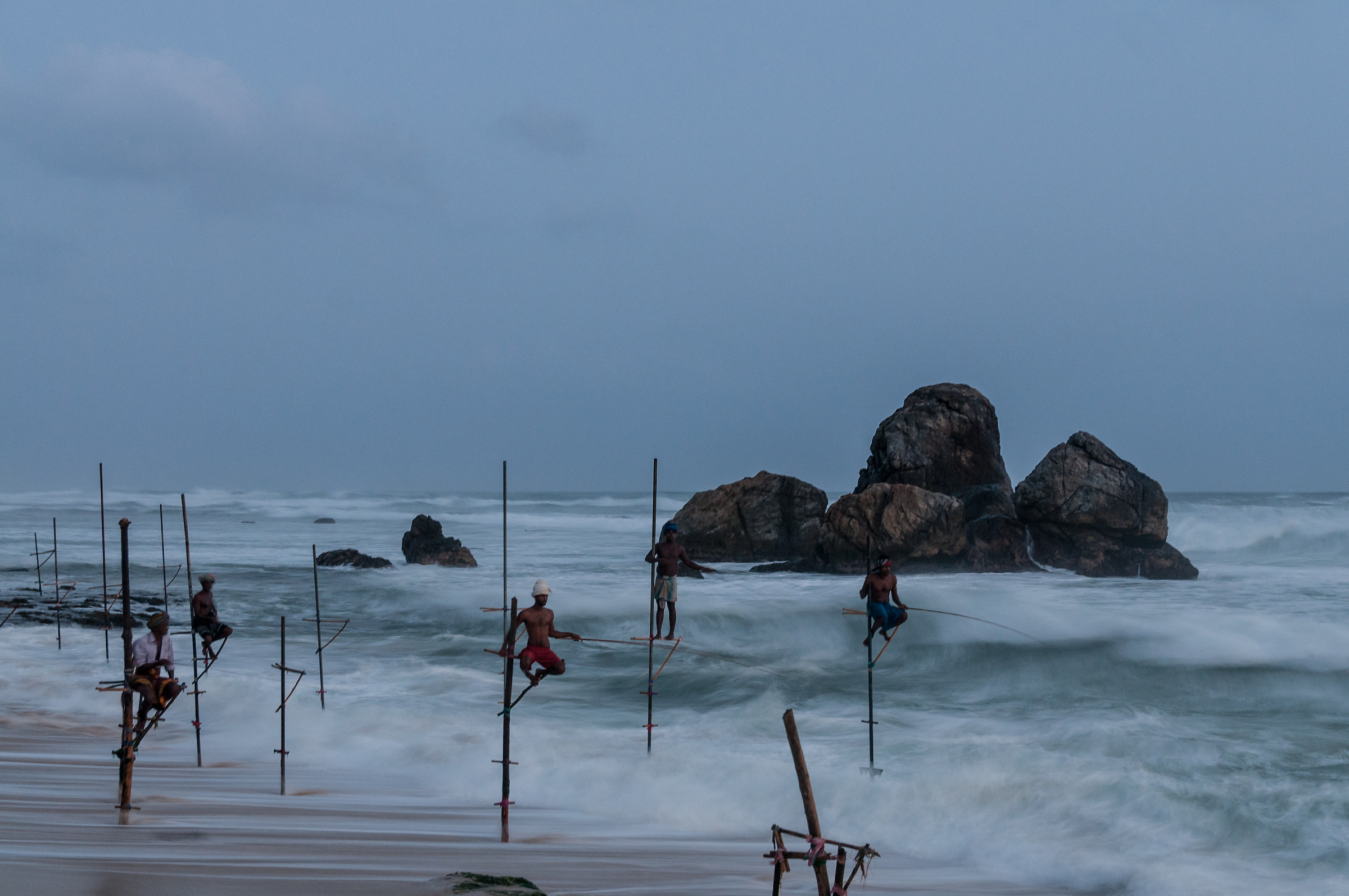Stilt fishing, under the moon light