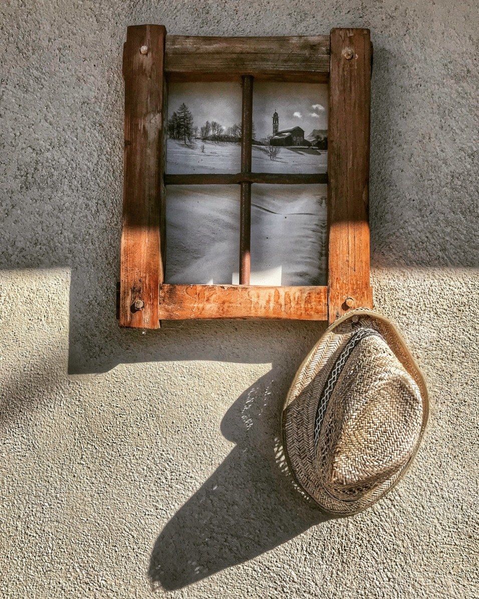 The hat hanging from the nail