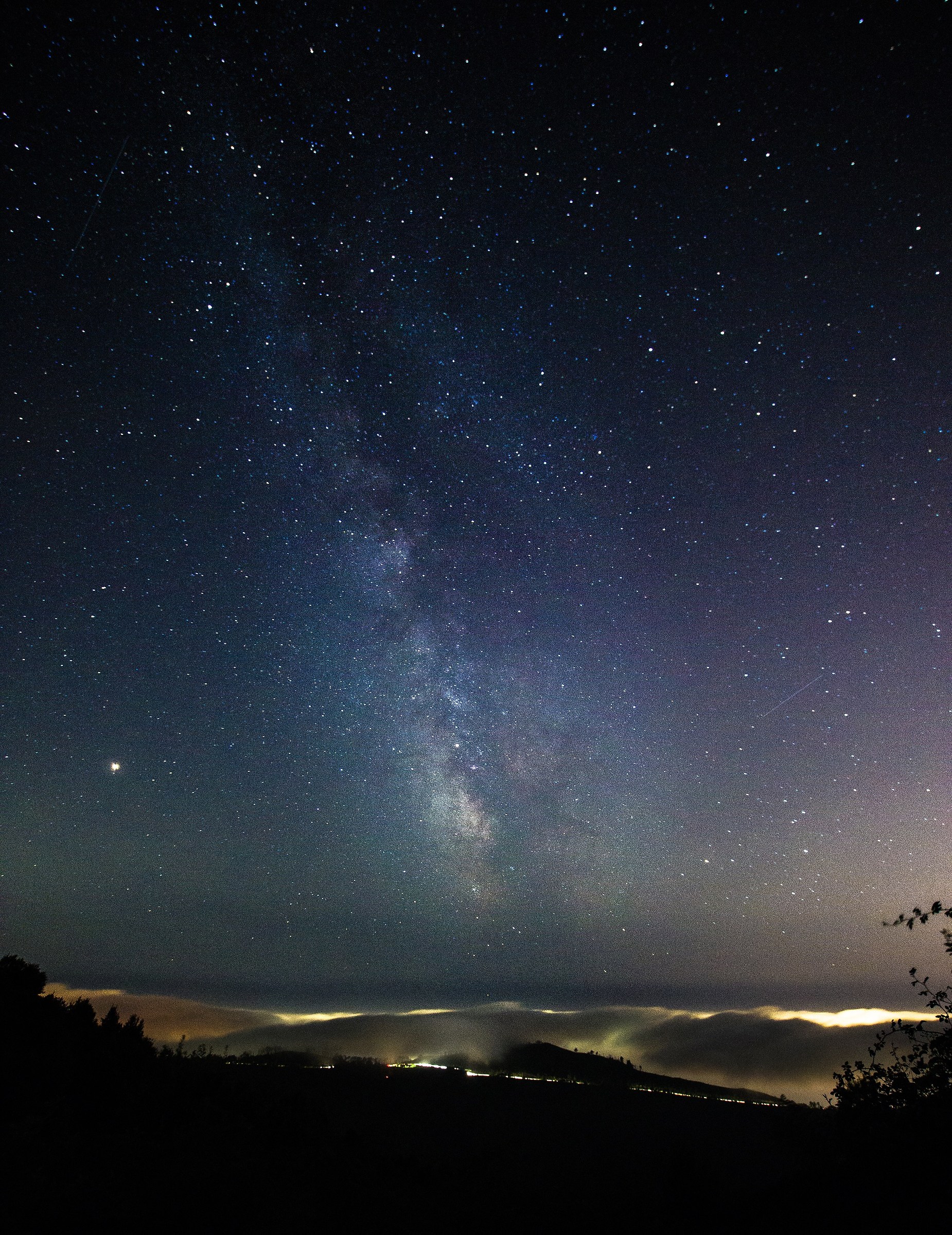The Milky Way over the clouds of Genoa
