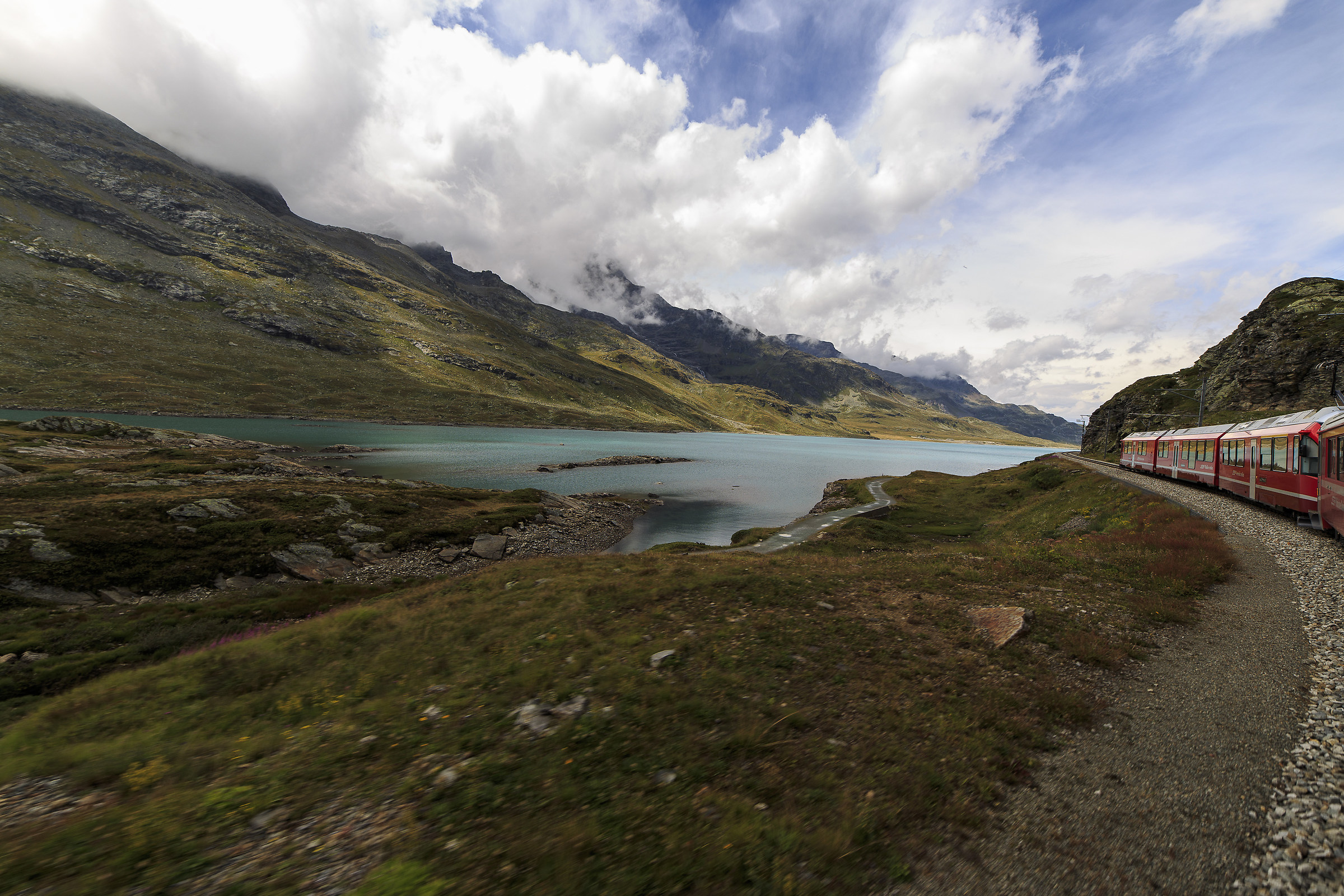 The red Bernina train on the white Lake