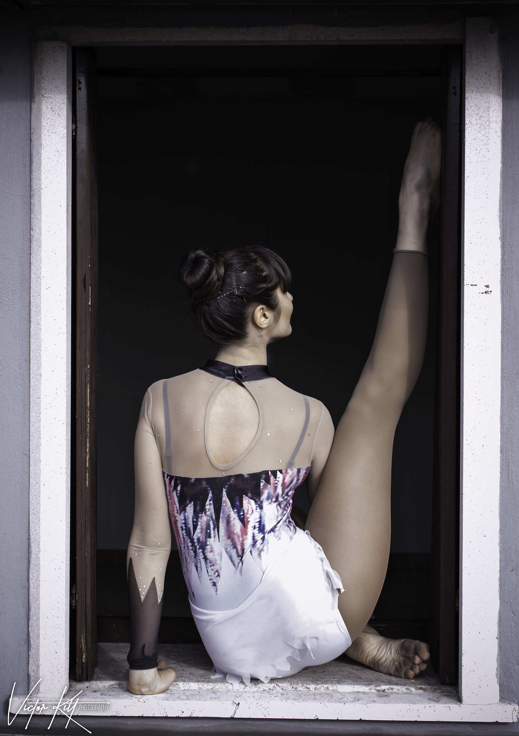 Mysterious gymnast by the window