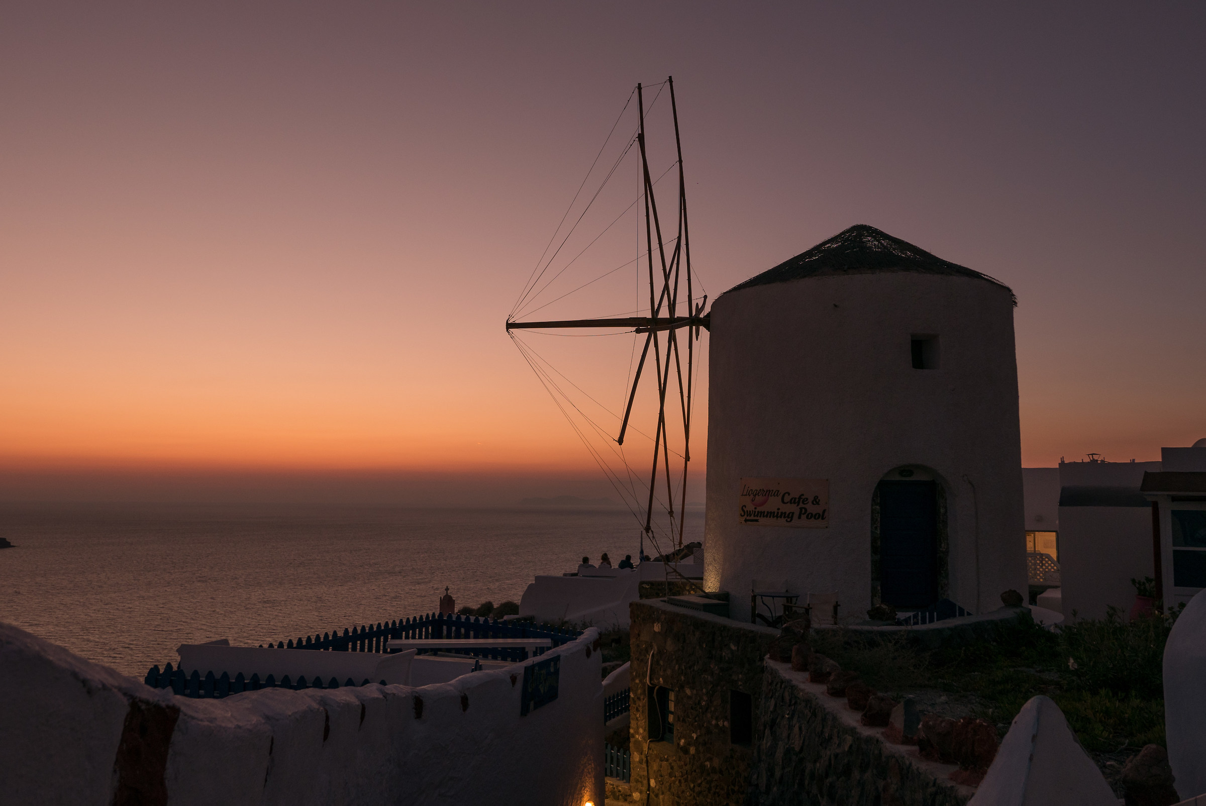 sunset at windmill santorini oia