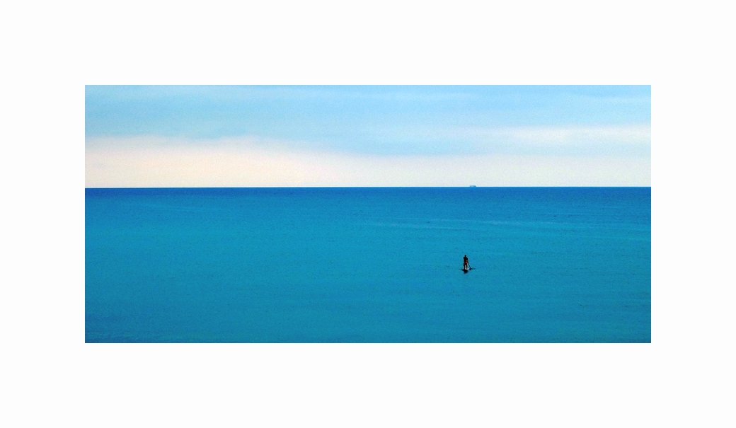 The lone surfer and the sea