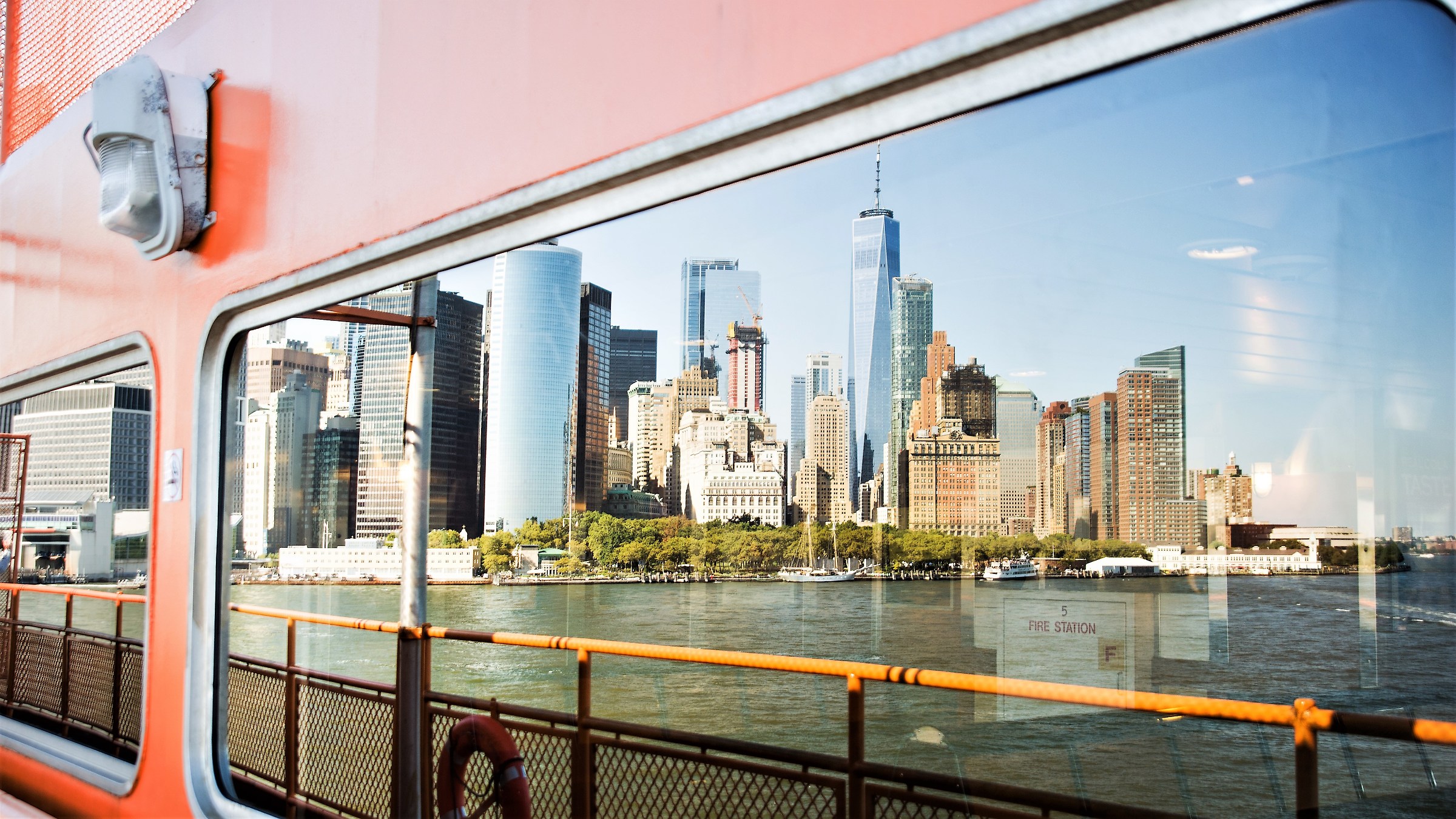 Manhattan view reflected on the ferry window