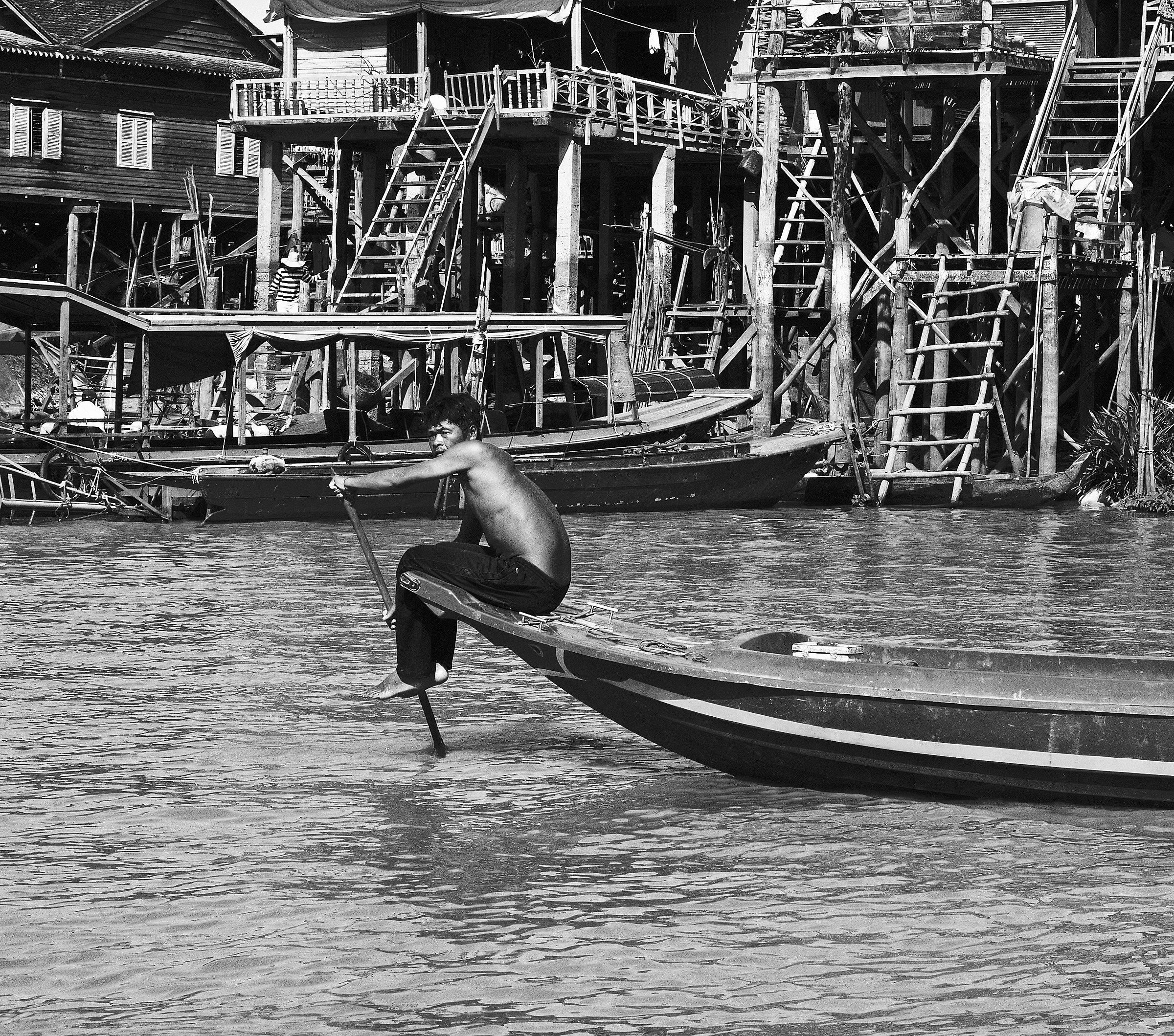 Gondoliere in boat and in the background...
