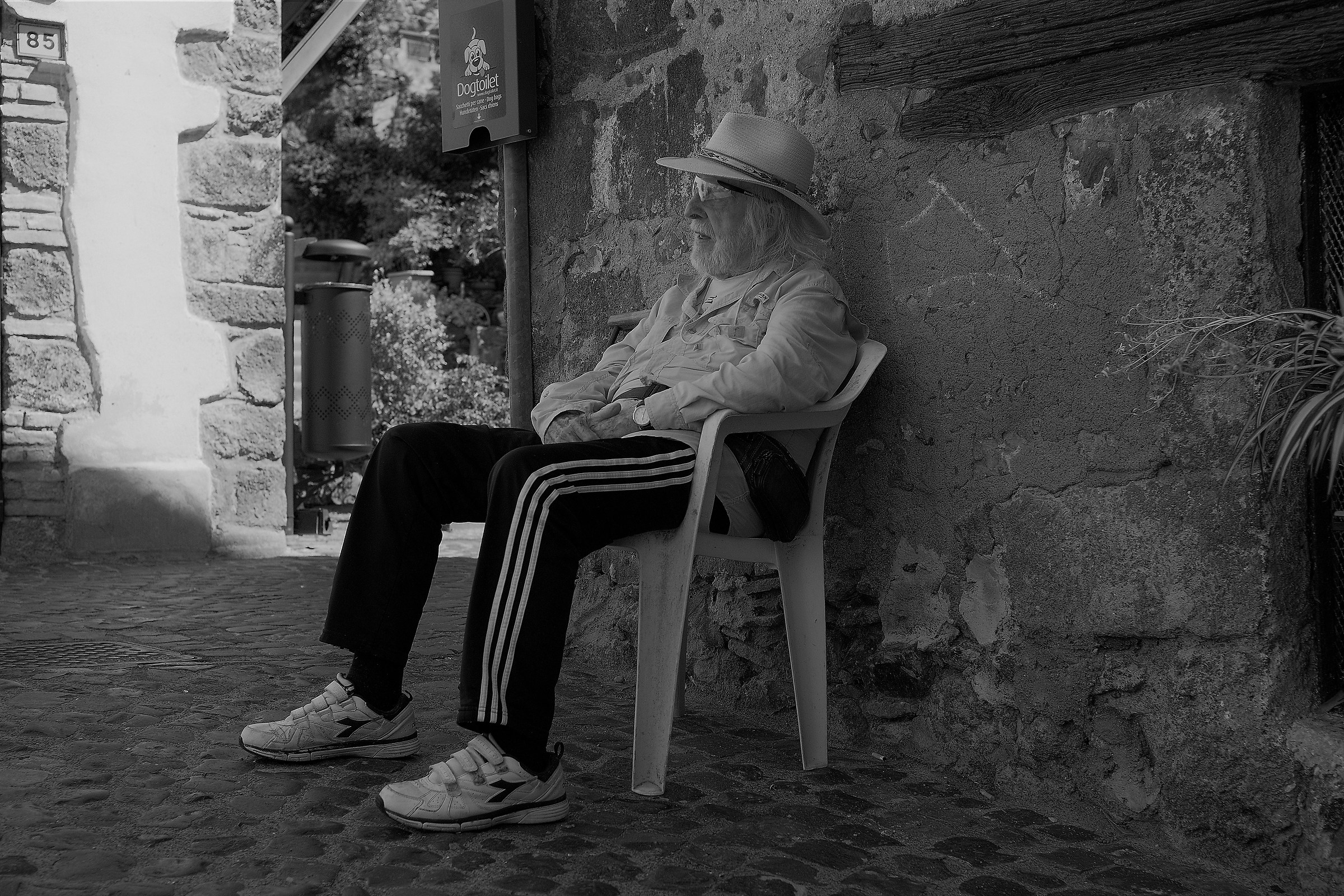 Euphemius rests in the shadow of the alley