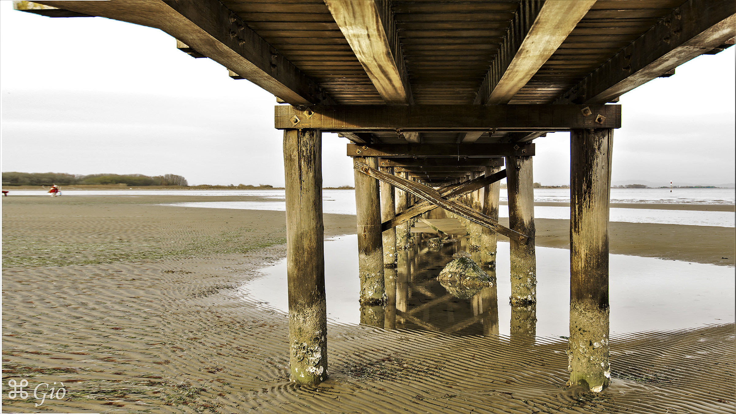 Low tide under walkway