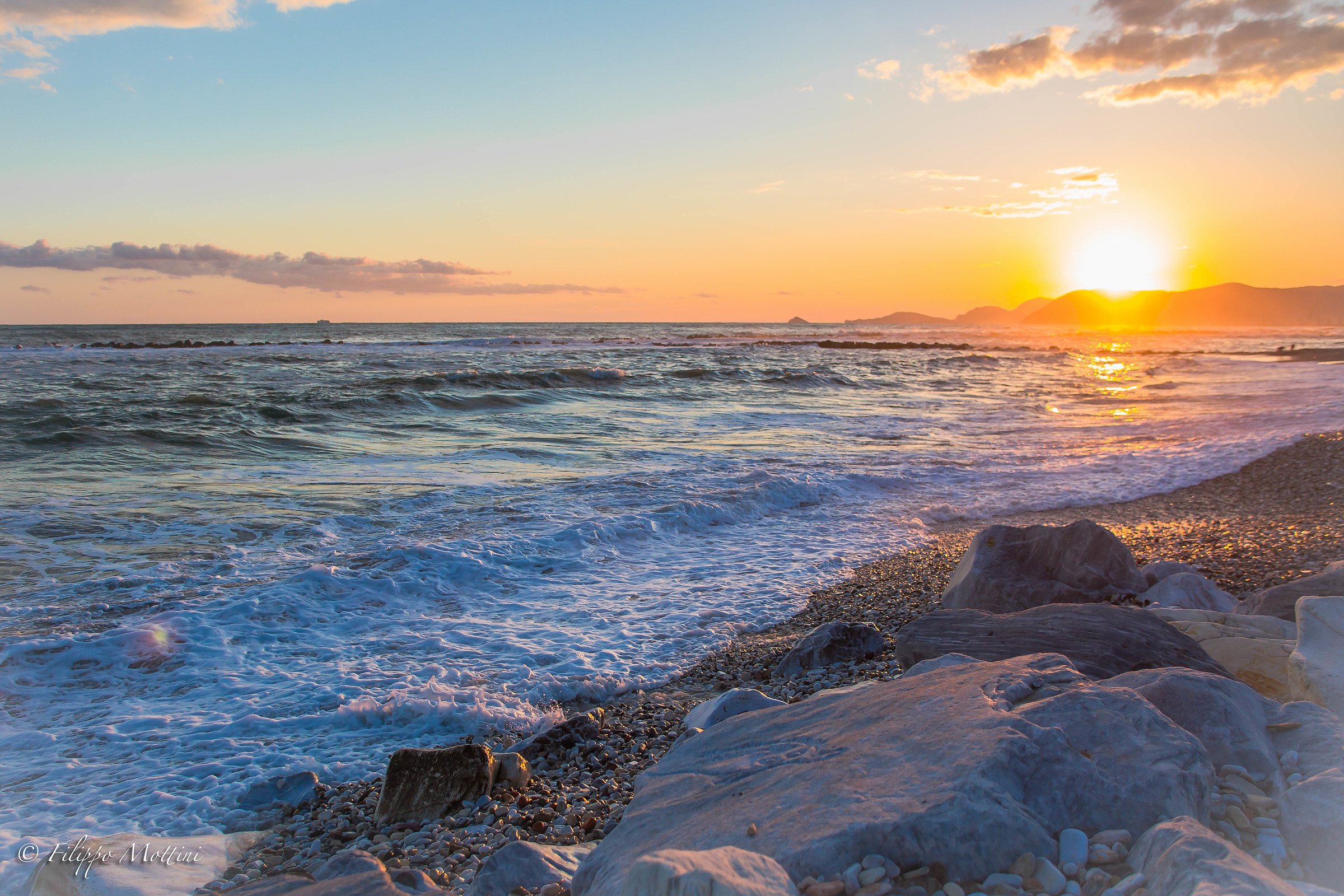 The rushing sea at sunset